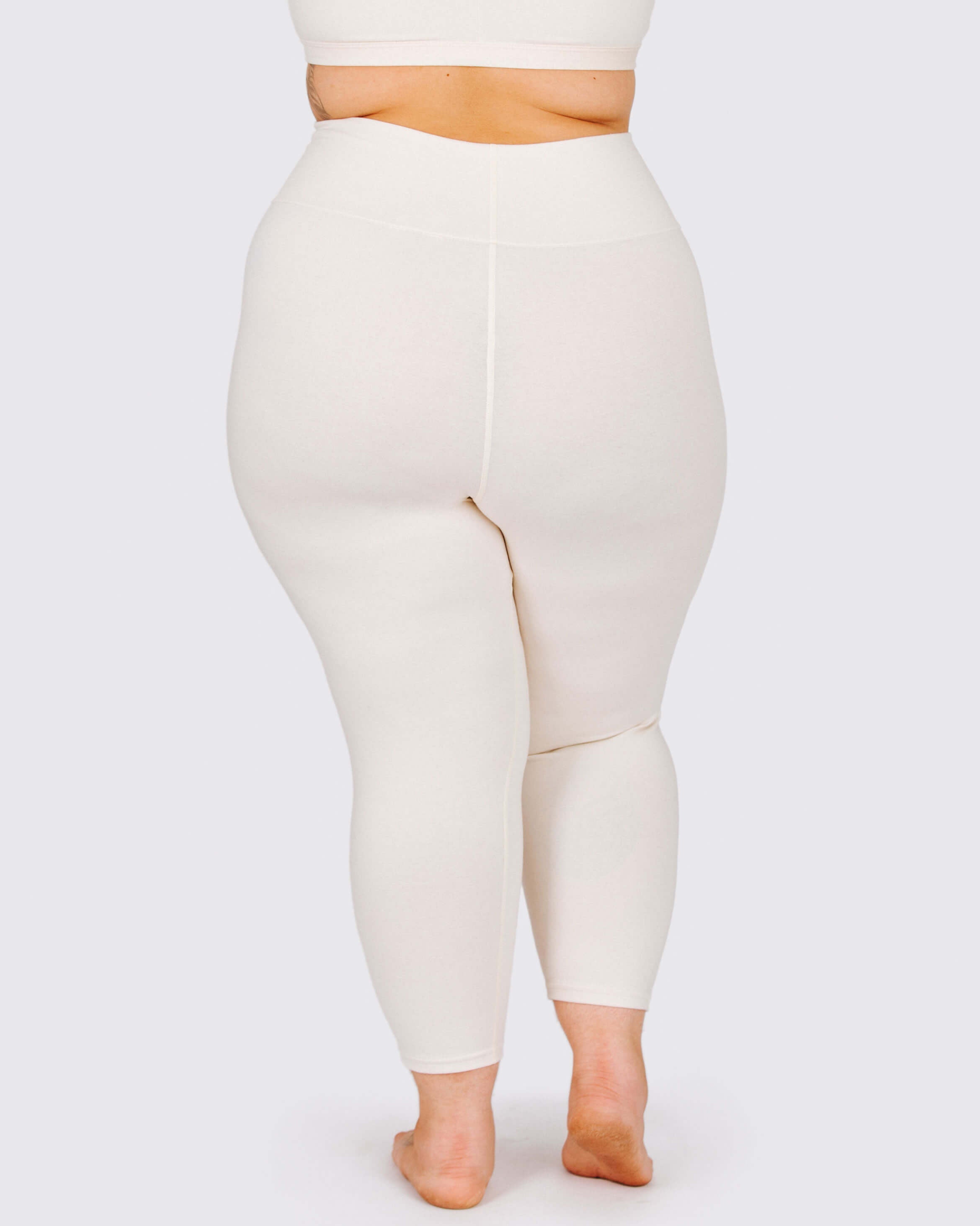 Fit photo from the back of Thunderpants organic cotton 3/4 Length Leggings in off-white on a model.