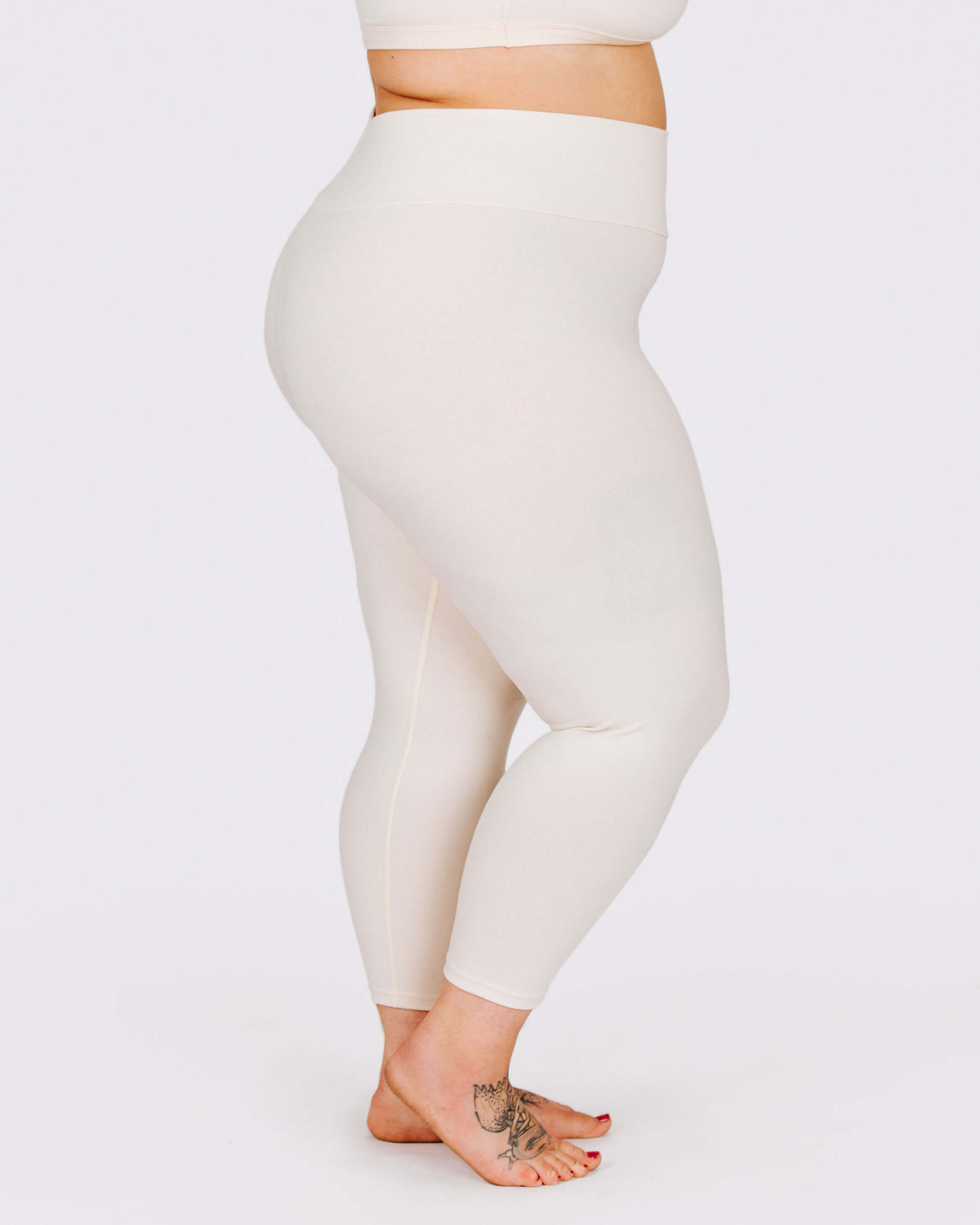 Fit photo from the side of Thunderpants organic cotton 3/4 Length Leggings in off-white on a model