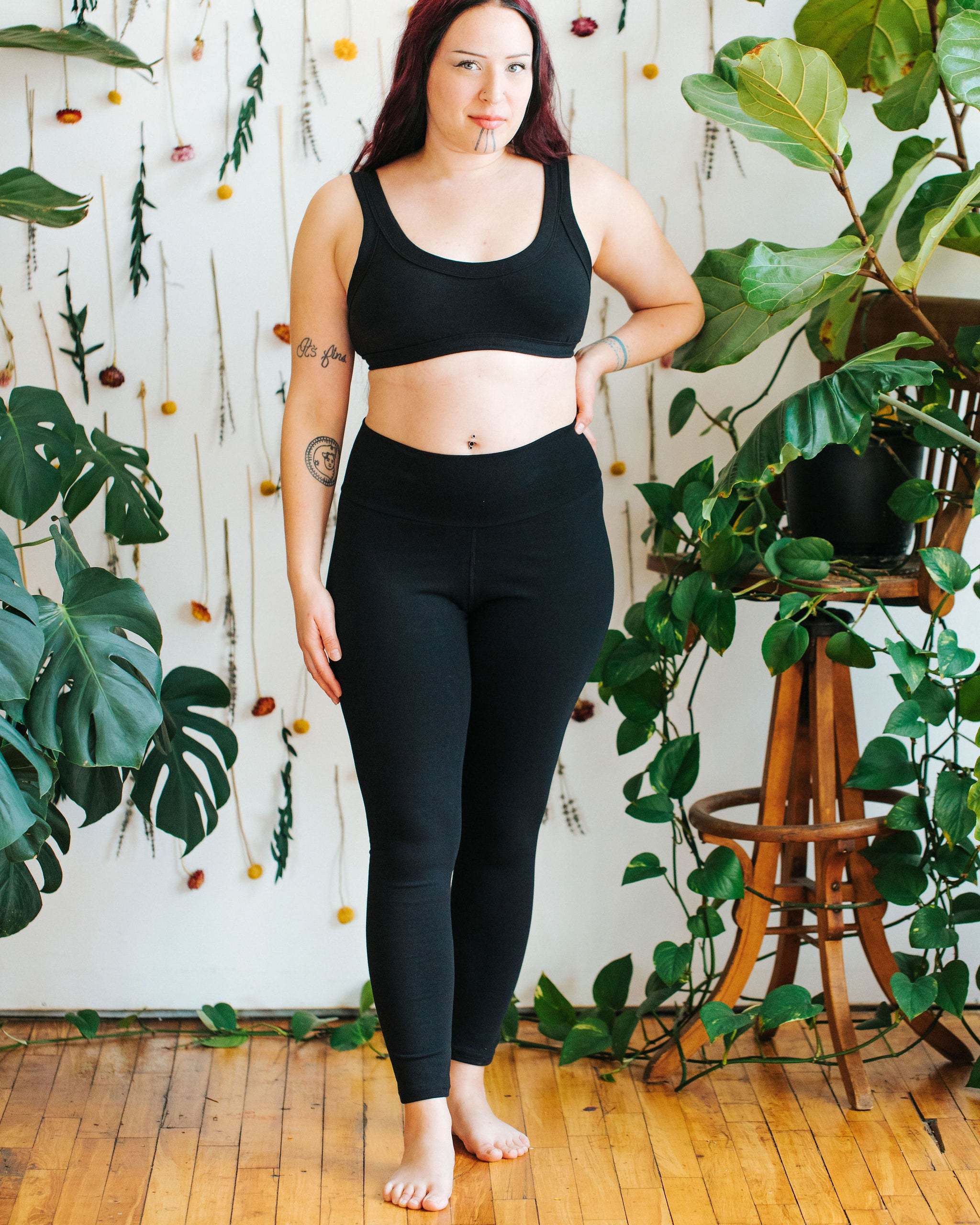 Close up image of model wearing Thunderpants Ankle Length Leggings in Plain Black.