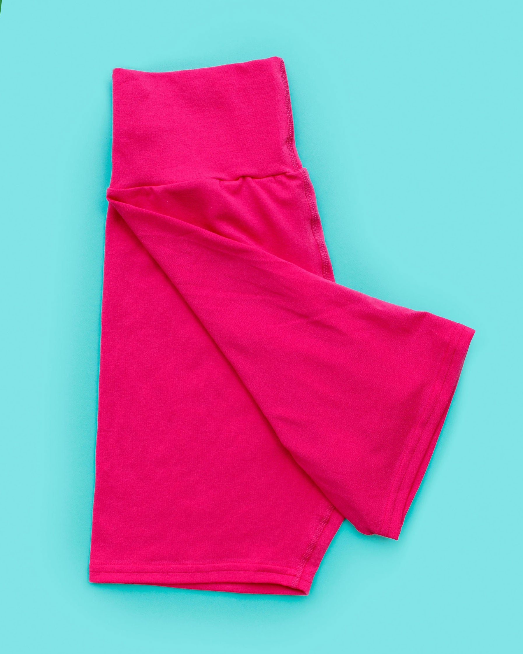 Flat lay of Thunderpants Bike Shorts in a hot pink color.