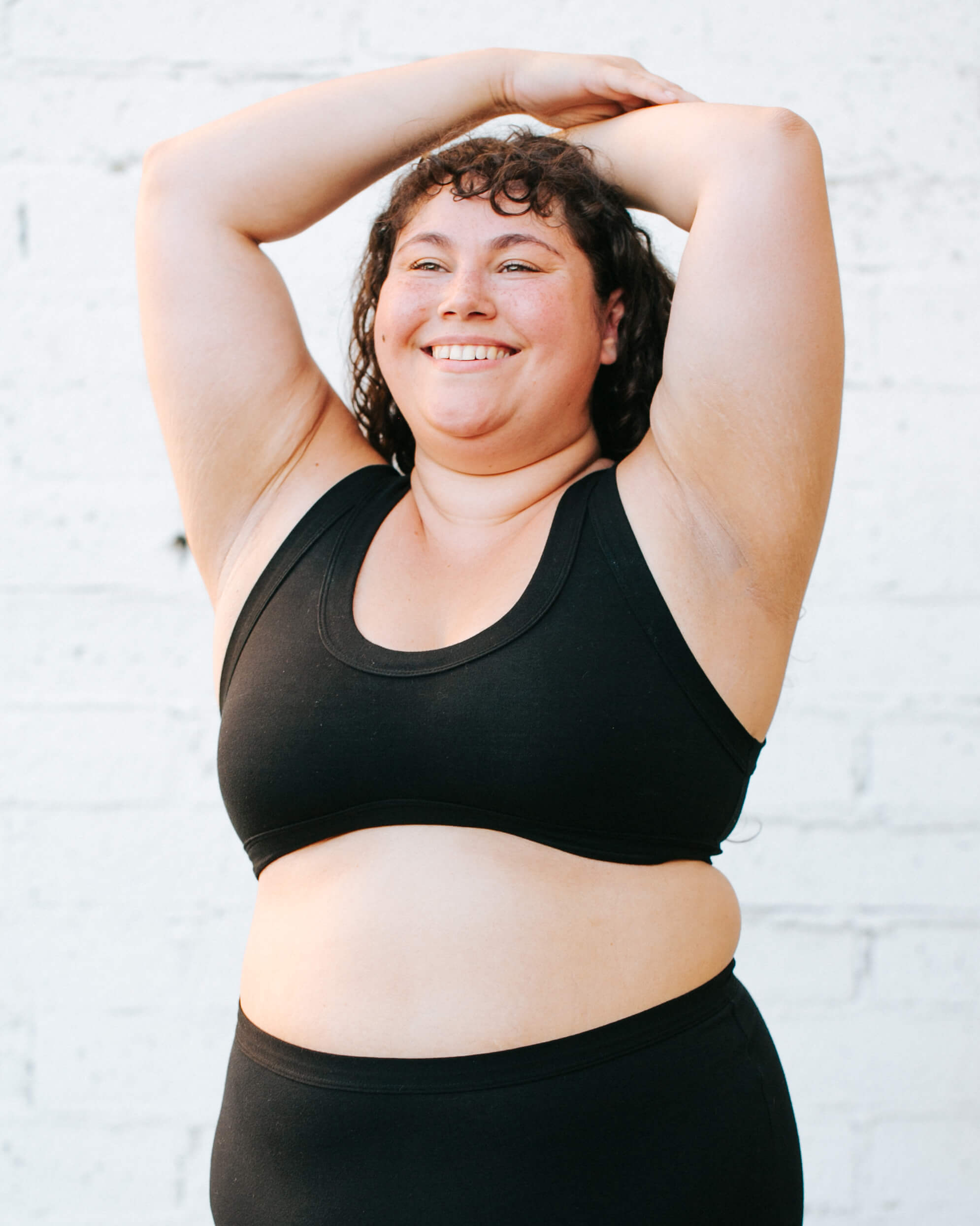 Close up of model wearing Thunderpants Bralette and Original style underwear in Plain Black.