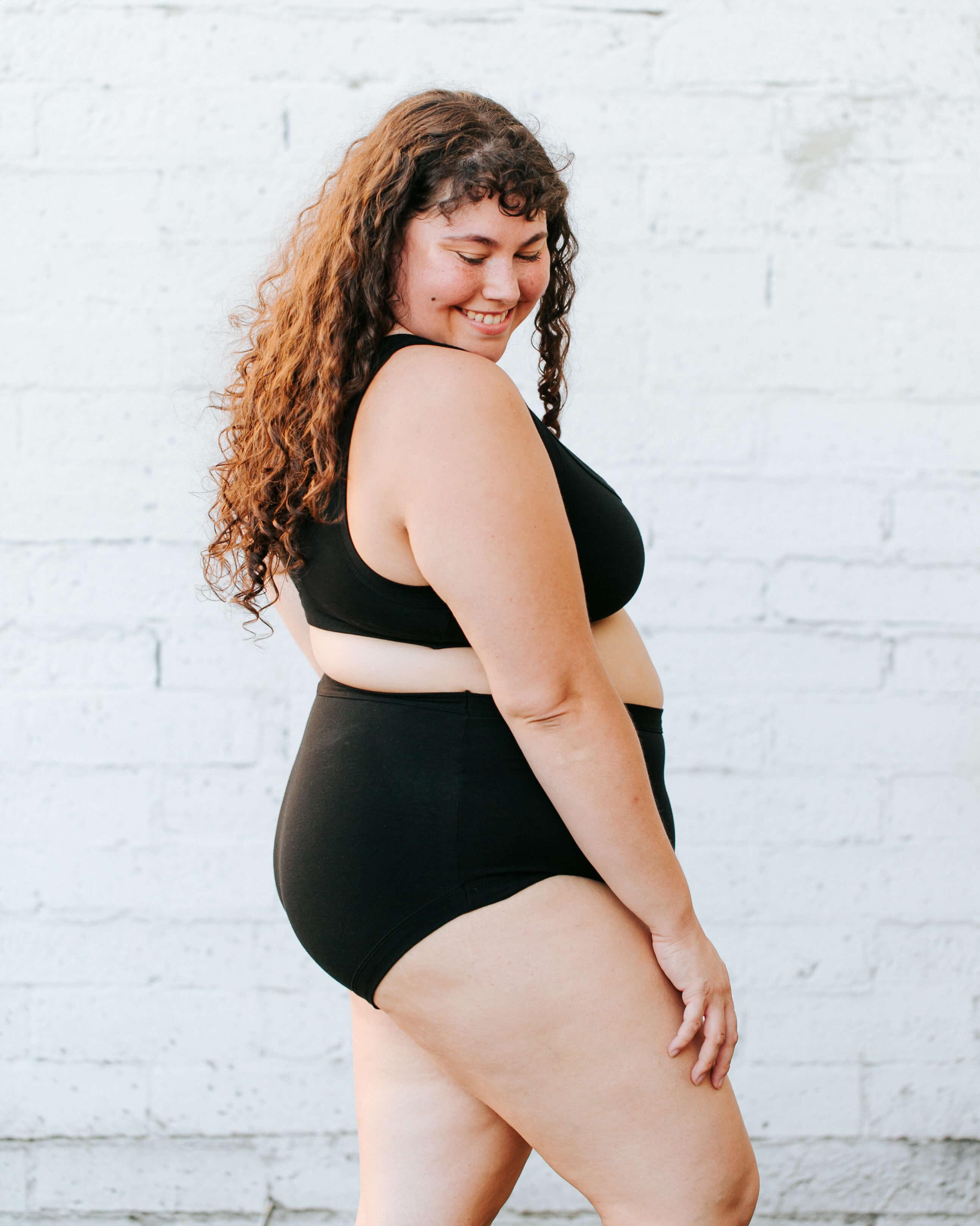 Close up of model wearing Thunderpants Original style underwear and Bralette in Plain Black.