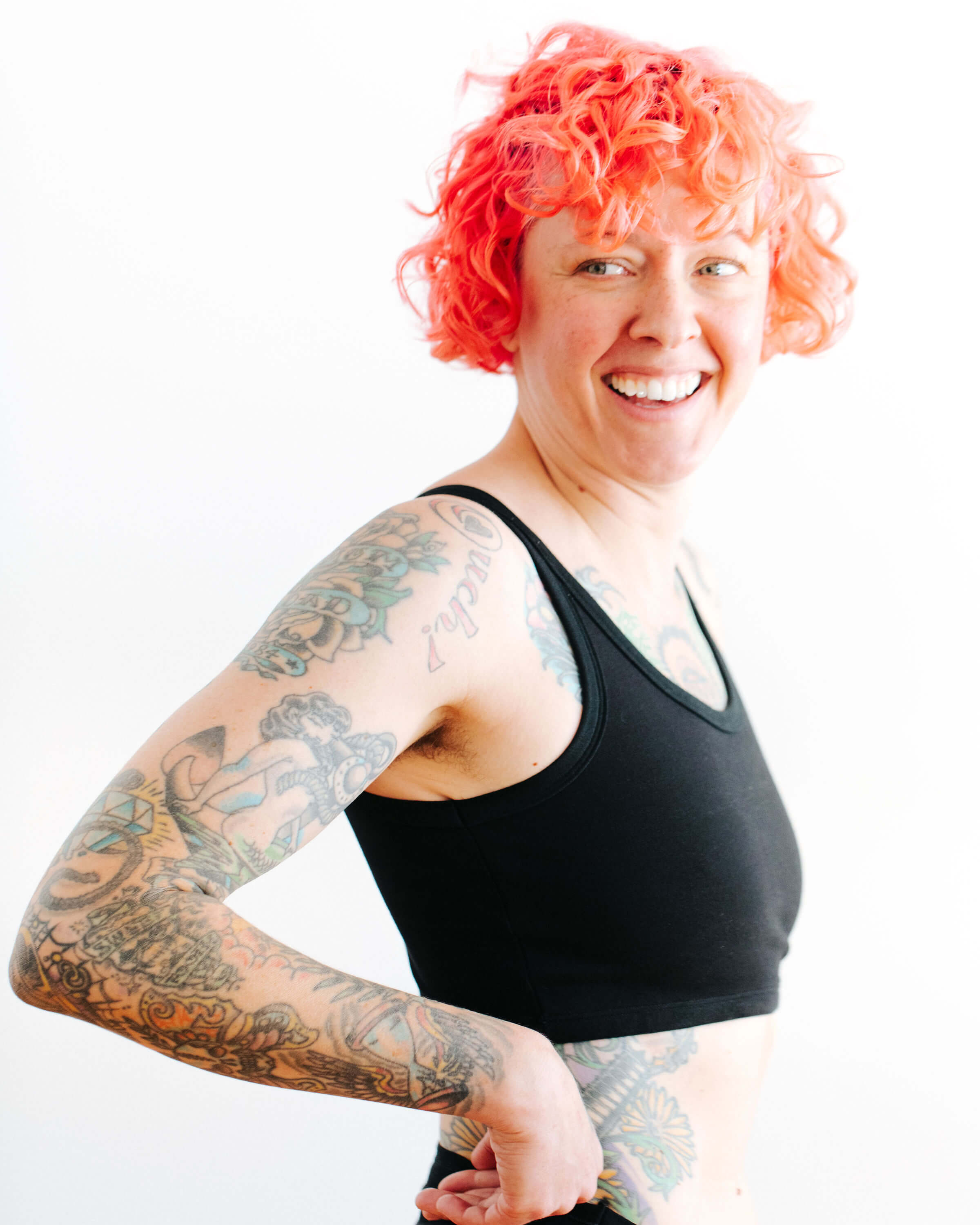 Close up of model wearing Thunderpants Longline Bra in Black.