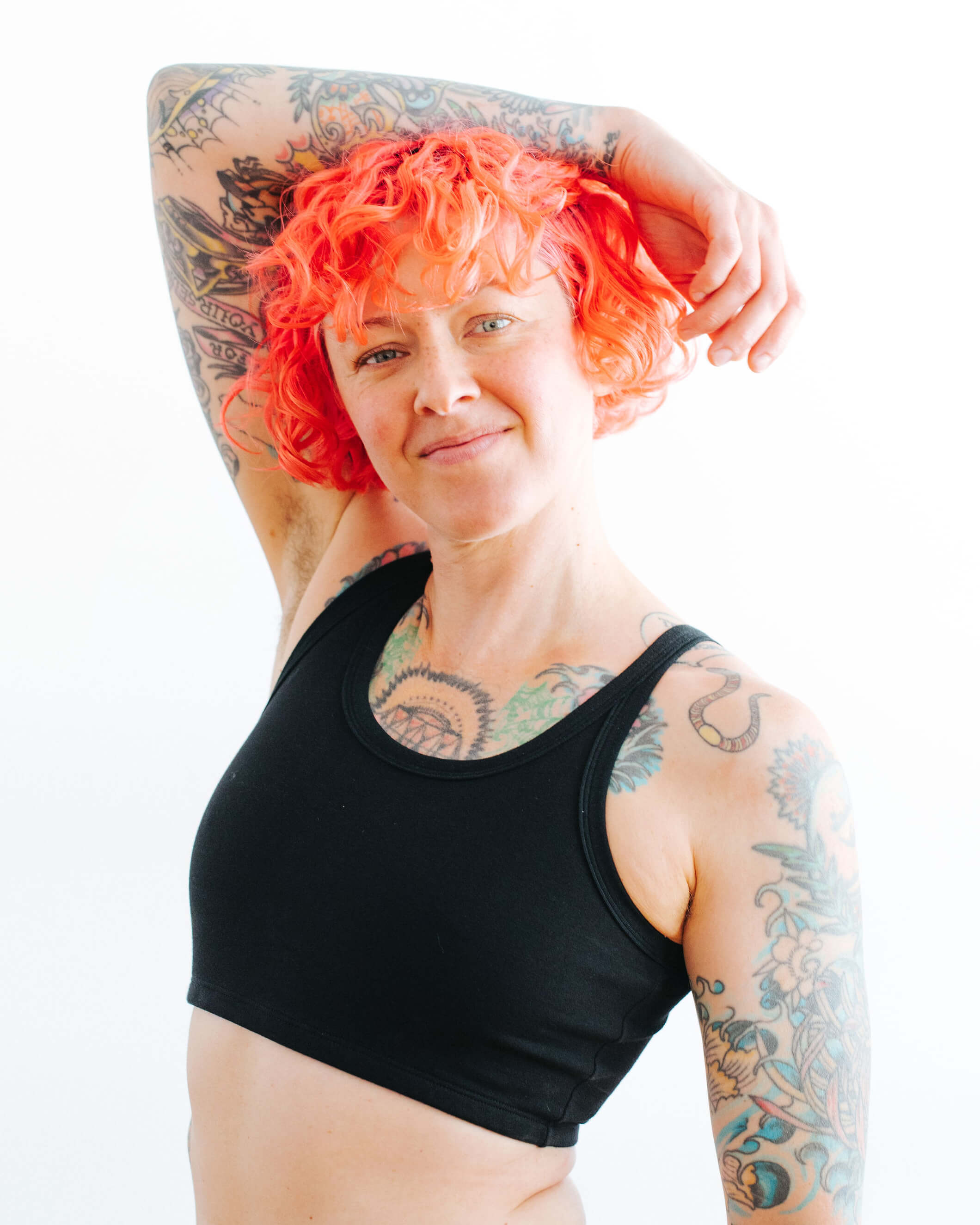 Close up of model wearing Thunderpants Longline Bra in Black.