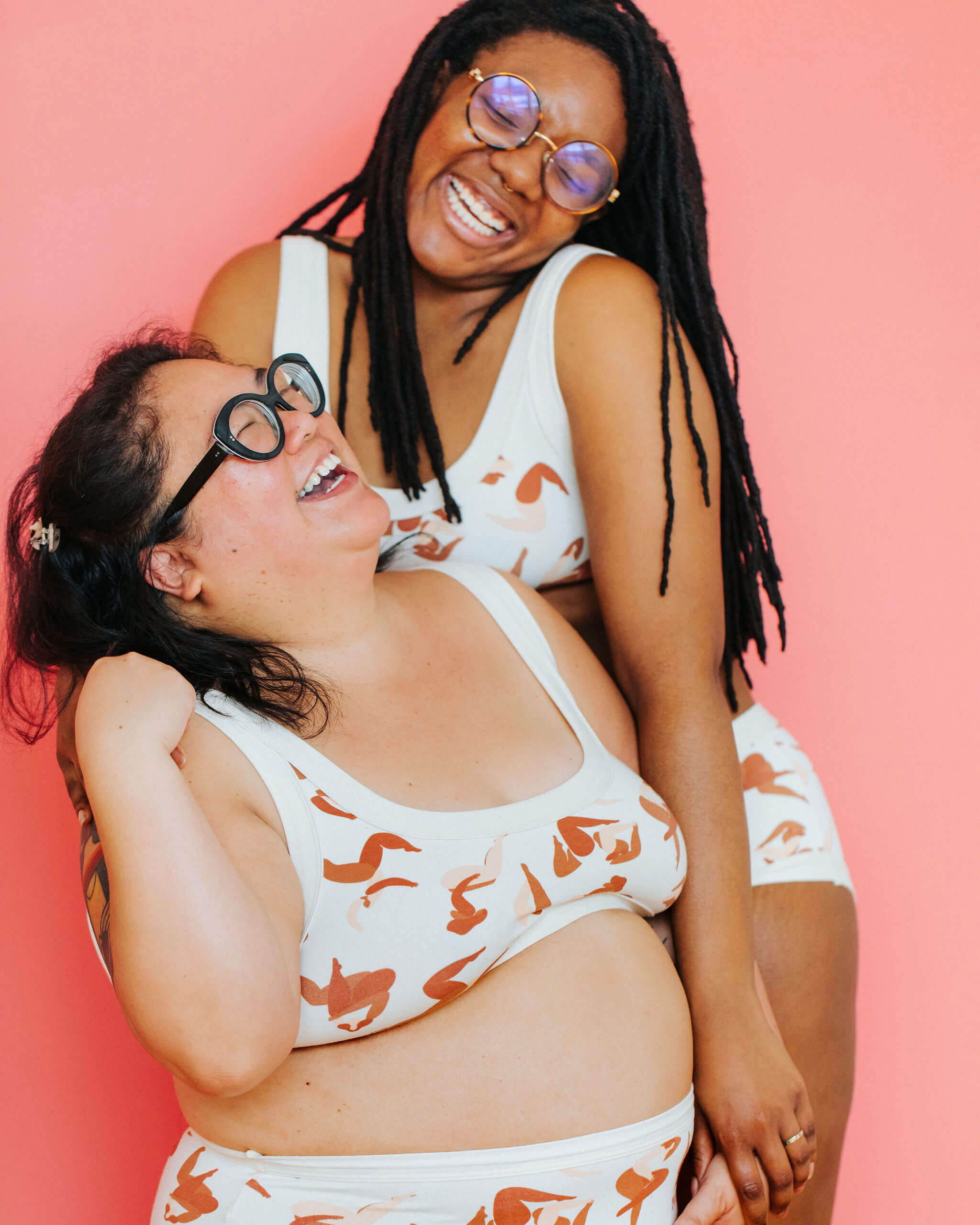 Two models wearing Thunderpants Bralettes in Bodies in Motion print.