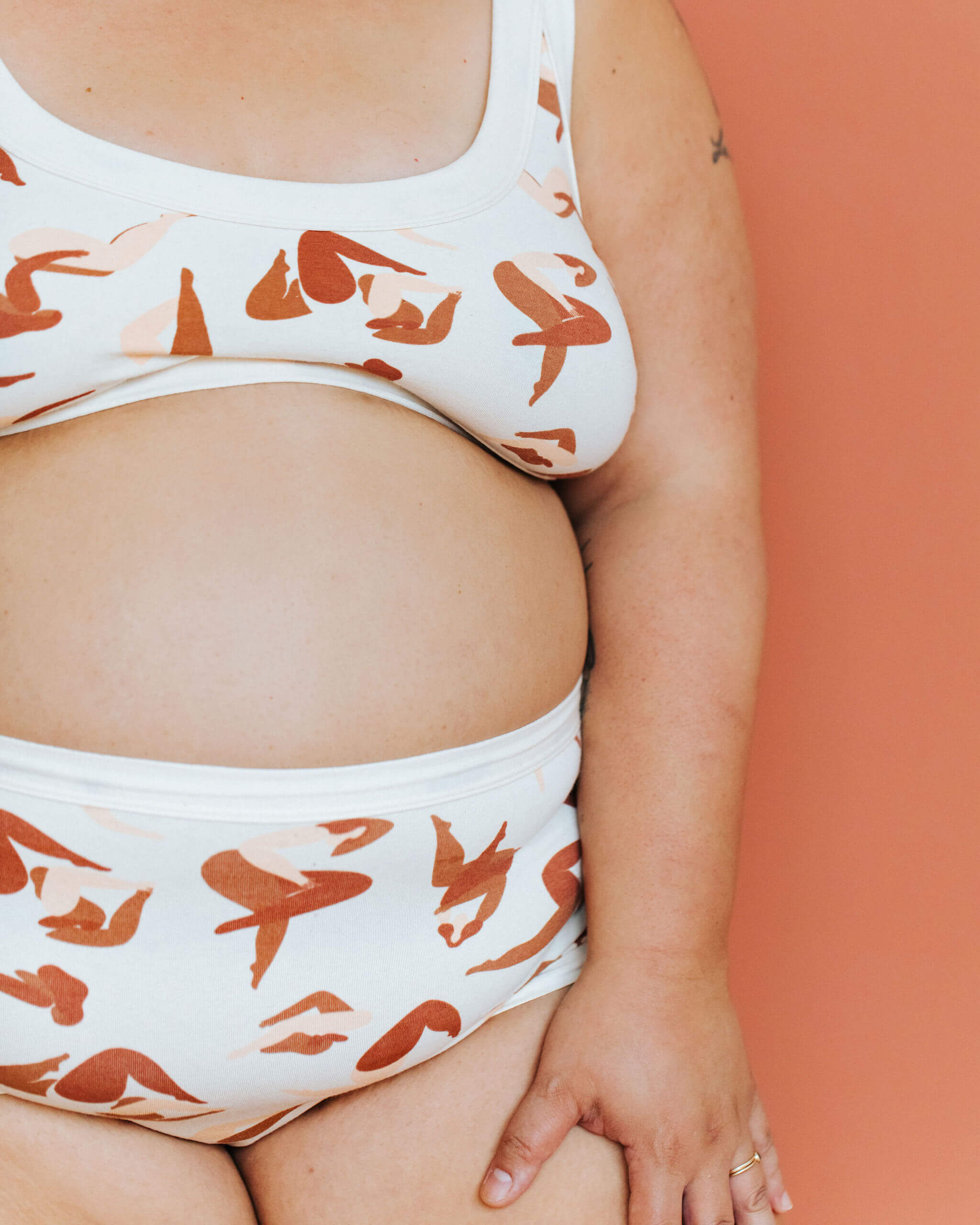 Close up of model wearing a set in Thunderpants Sky Rise style underwear and Bra in Bodies in Motion print.