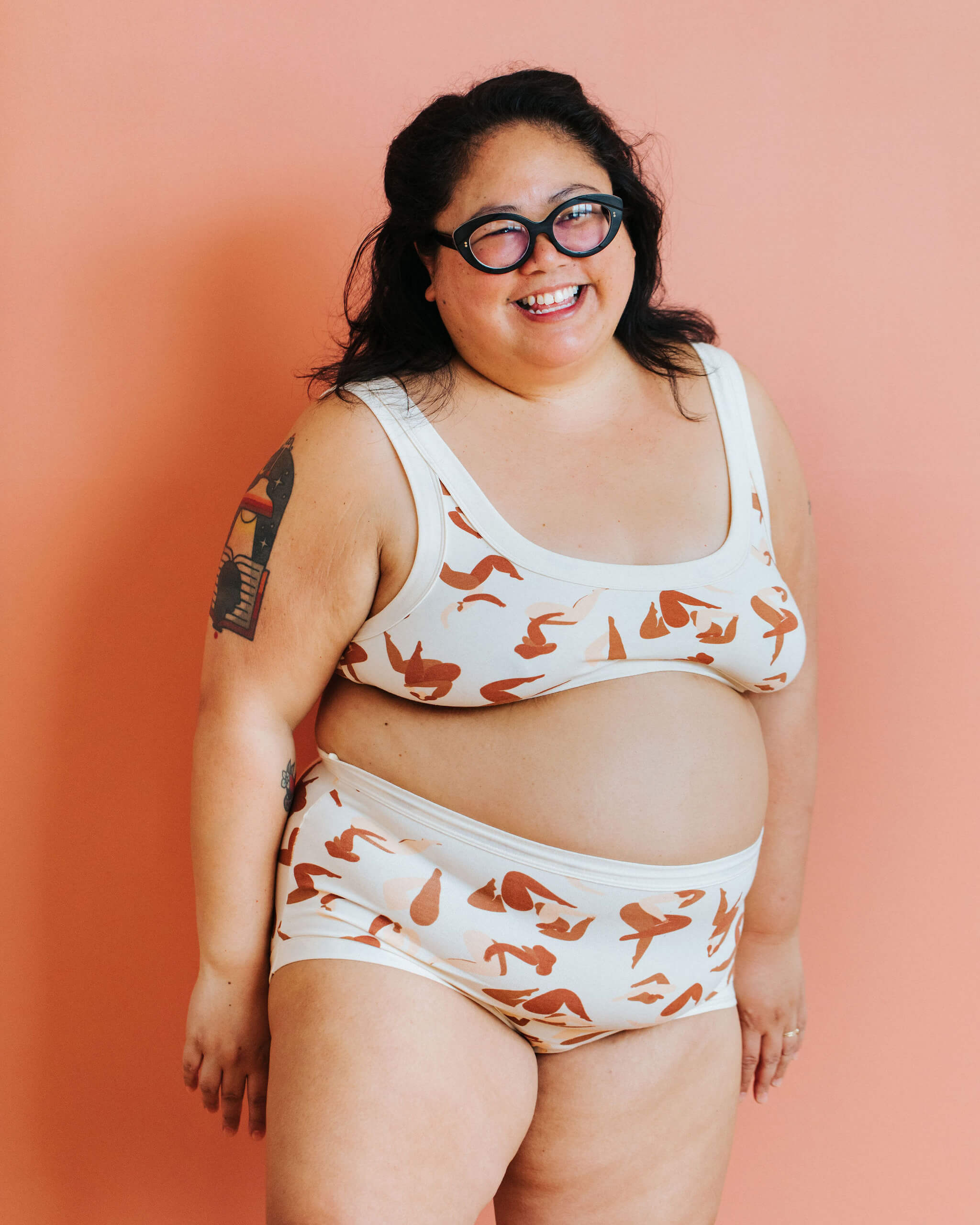 Model wearing a set in Thunderpants Sky Rise style underwear and Bra in Bodies in Motion print.