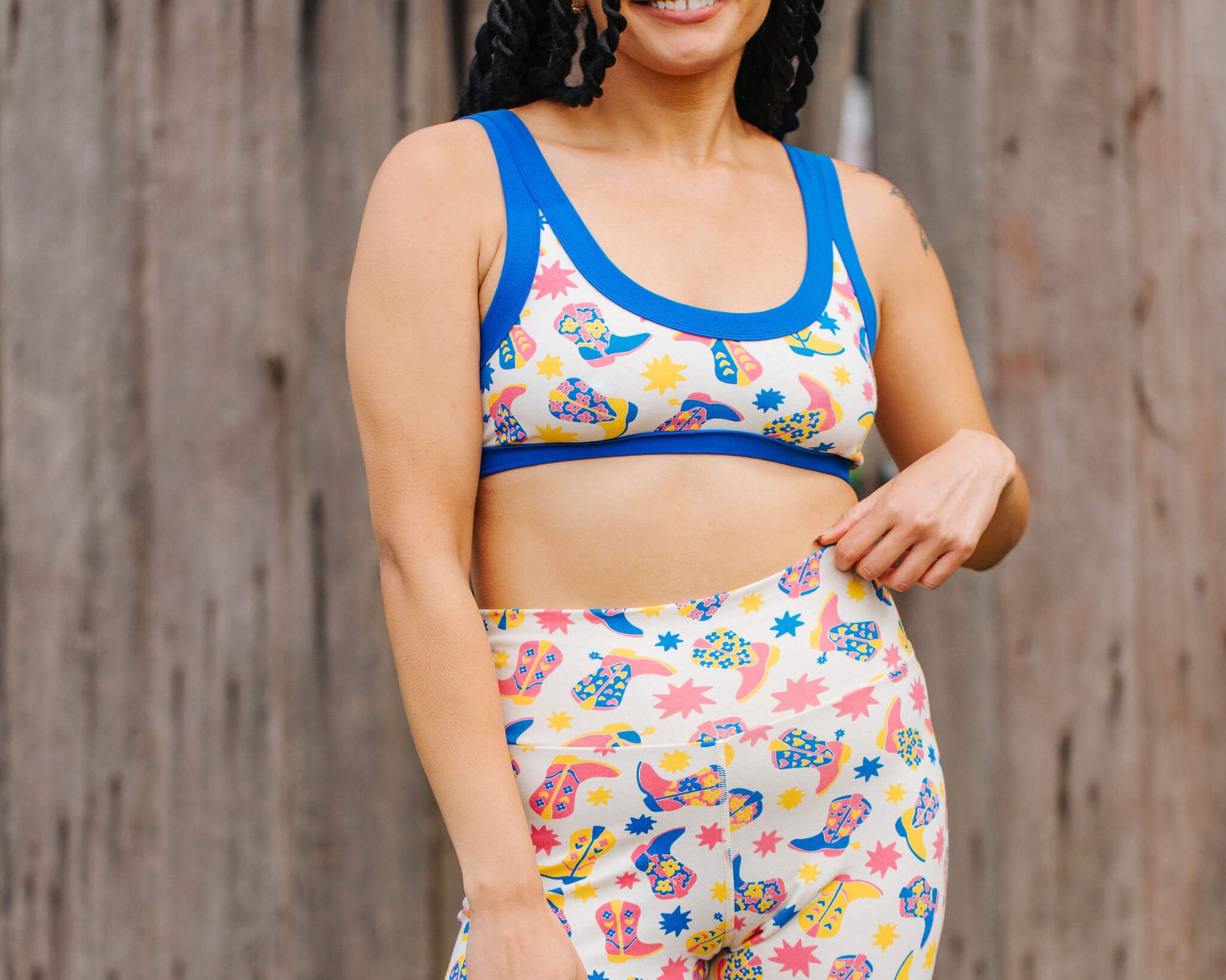 Model wearing a set of Thunderpants Bike Shorts and Bralette in Boot Scootin' print.