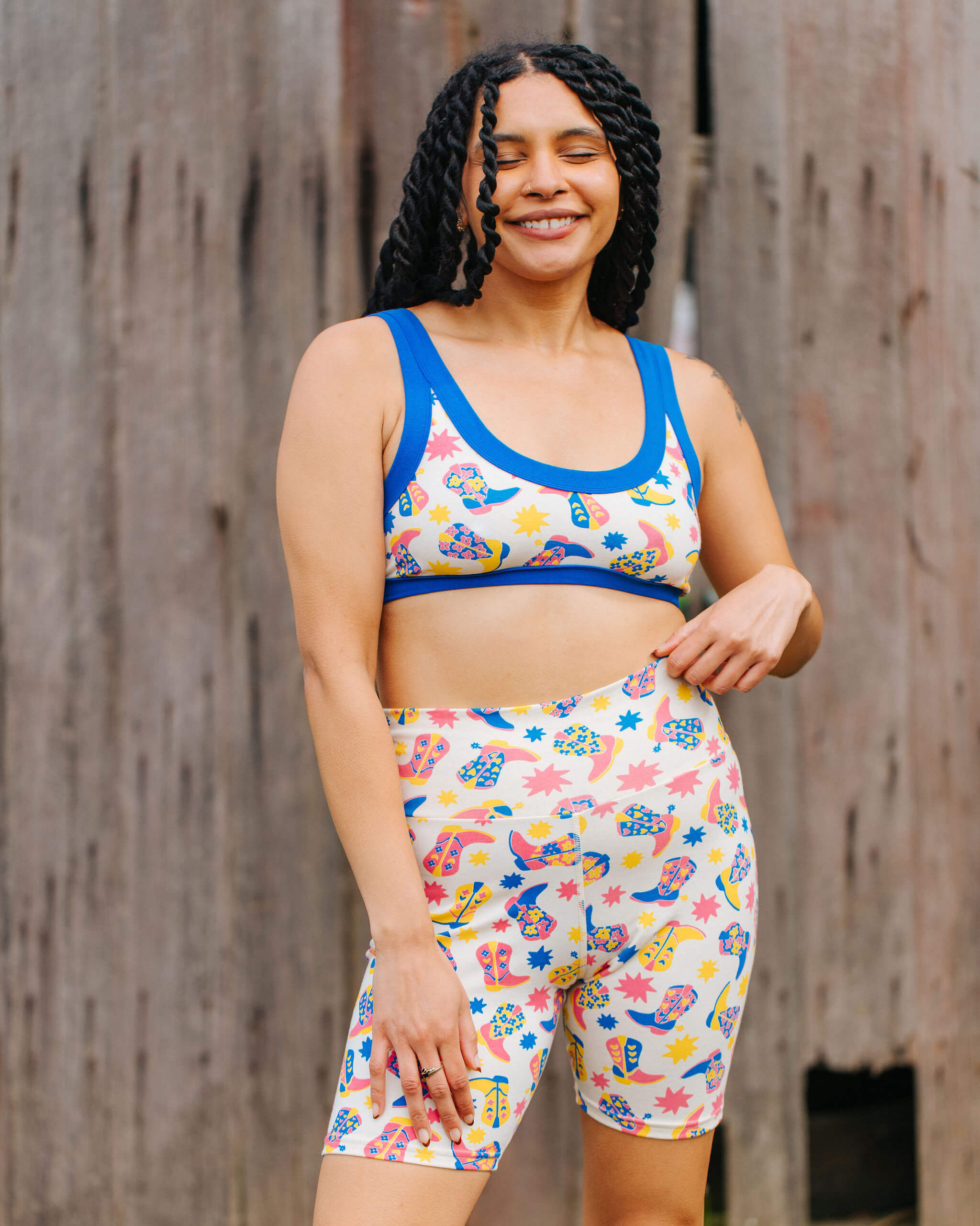 Model wearing a set of Thunderpants Bike Shorts and Bralette in Boot Scootin' print.
