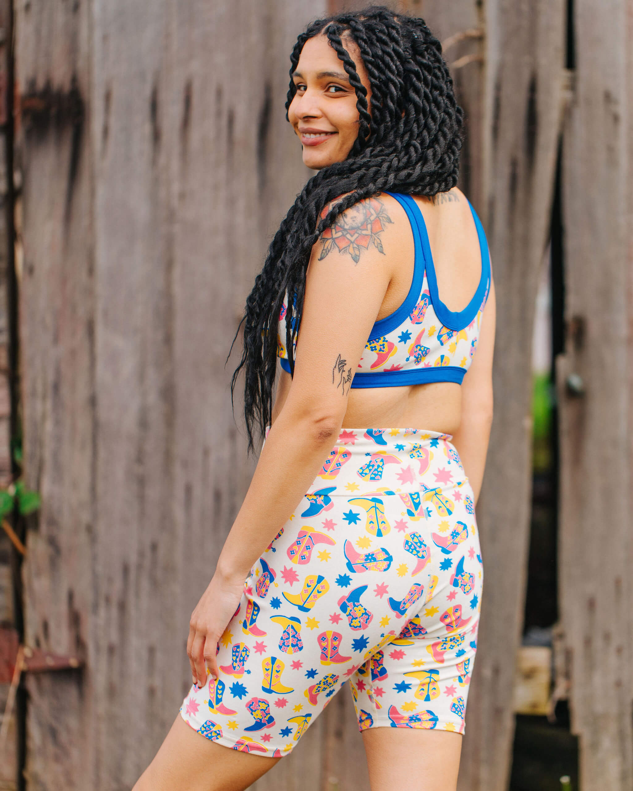 Model wearing a set of Thunderpants Bike Shorts and Bralette in Boot Scootin' print.