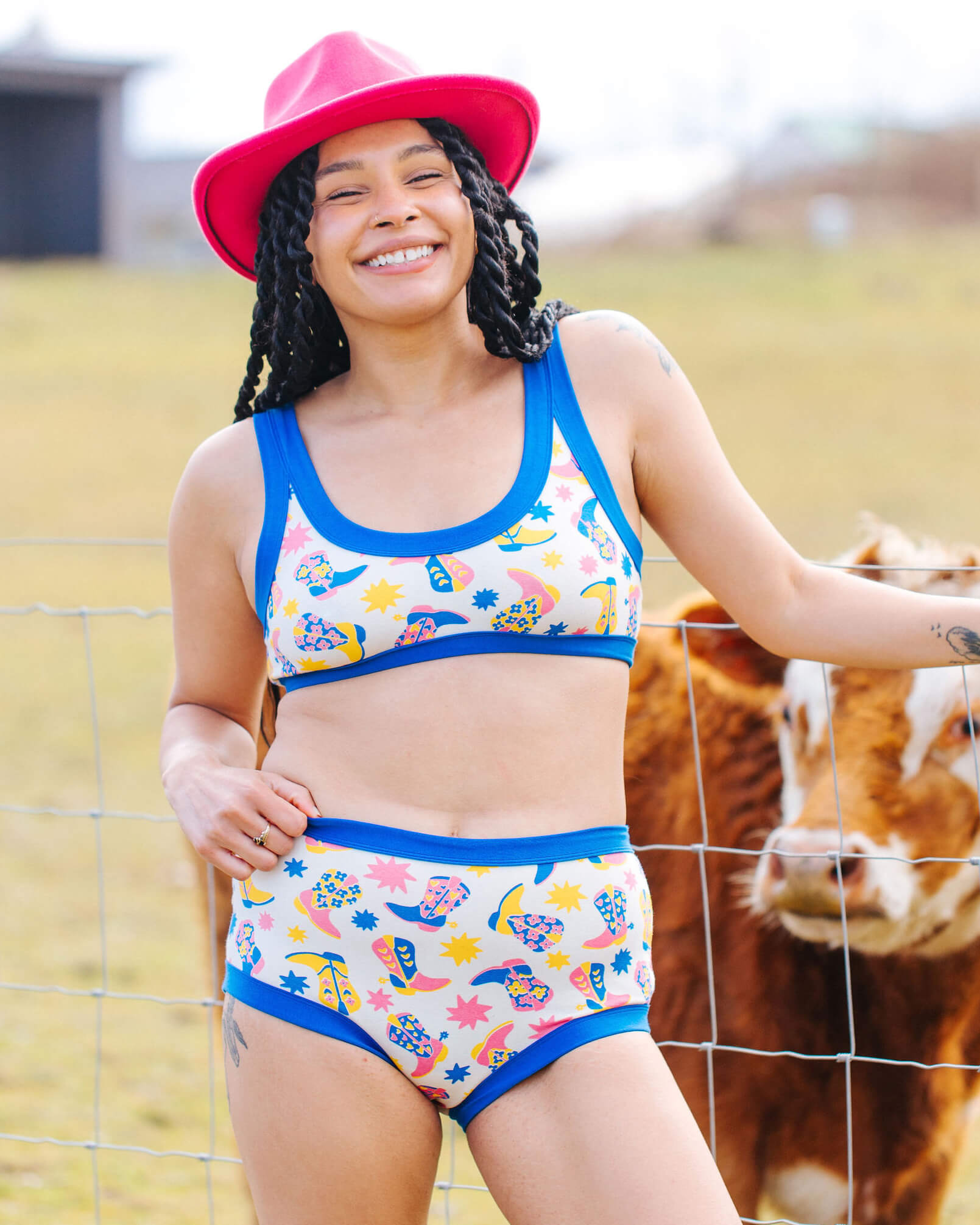 Model wearing a set of Thunderpants Bralette and Hipster style underwear in Boot Scootin' Print.