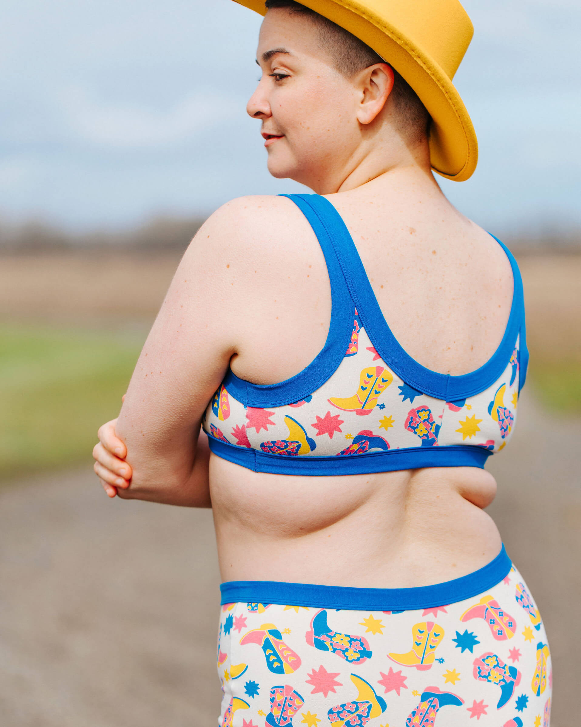 Close up of model wearing a set of Thunderpants Bralette and Original style underwear in Boot Scootin' Print.