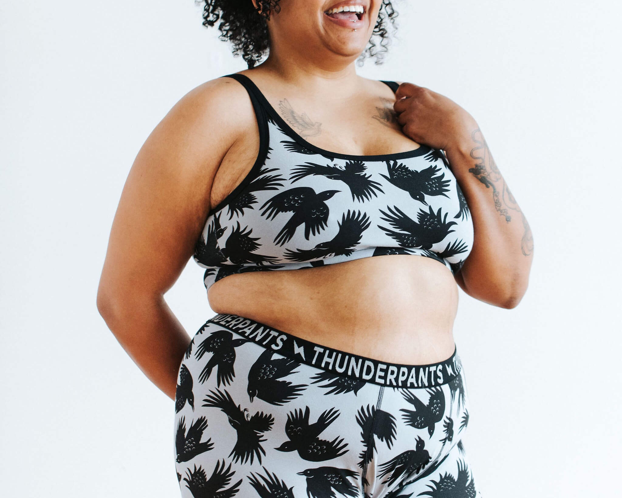 Model wearing Thunderpants Boxer Brief style underwear and Longline Bra in So it Crows print - black crows on grey.