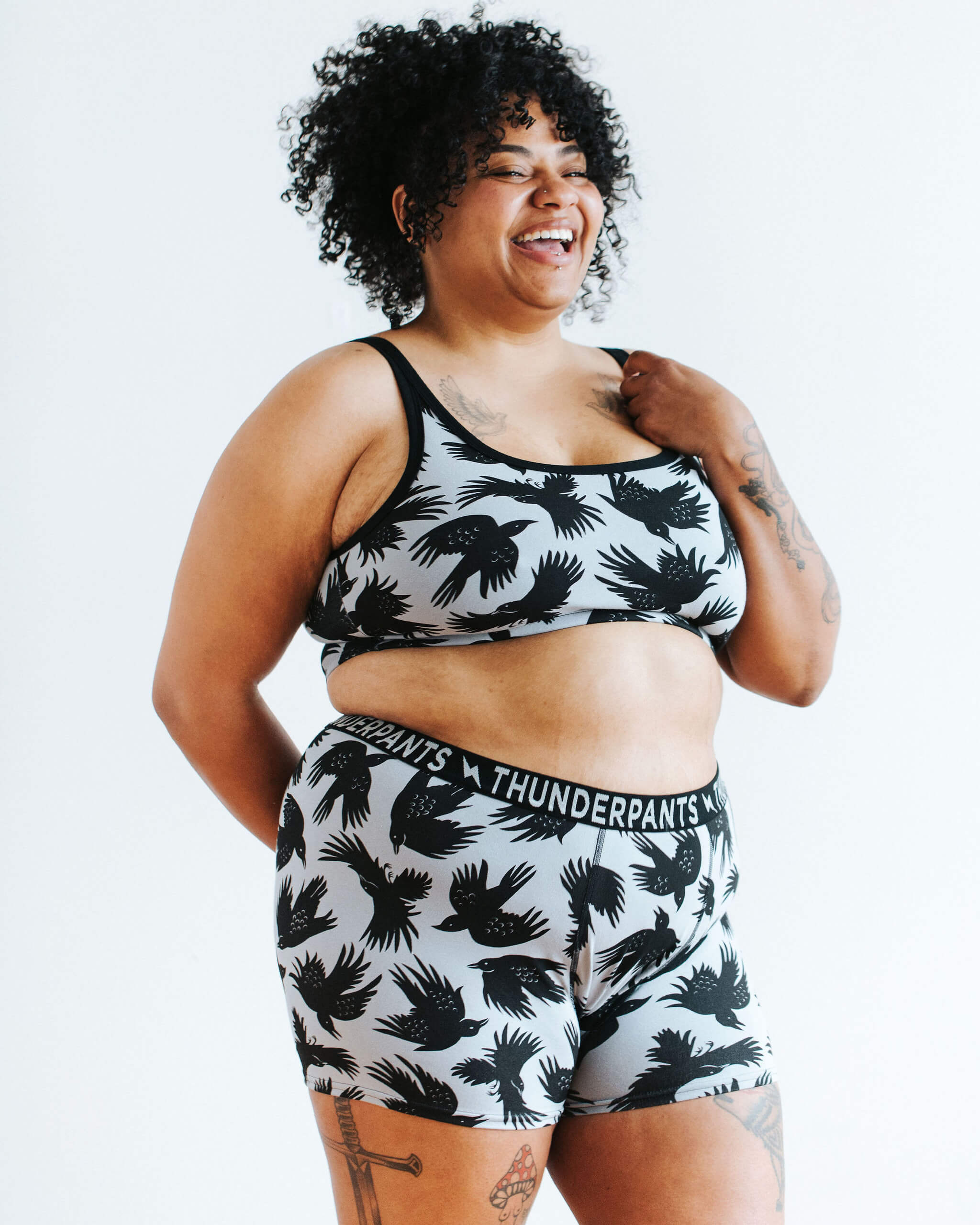 Model wearing Thunderpants Boxer Brief style underwear and Longline Bra in So it Crows print - black crows on grey.