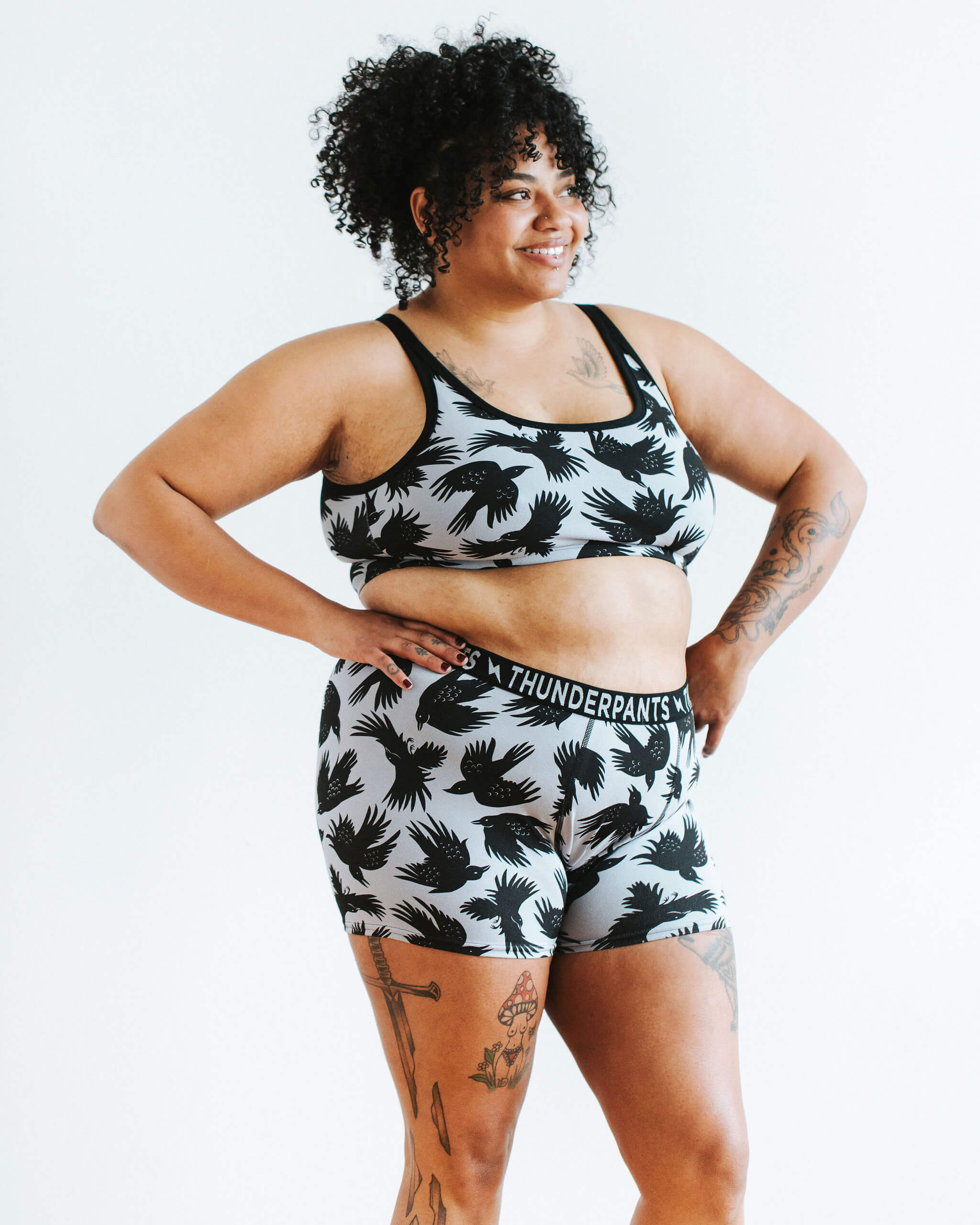 Model wearing Thunderpants Boxer Brief style underwear and Longline Bra in So it Crows print - black crows on grey.