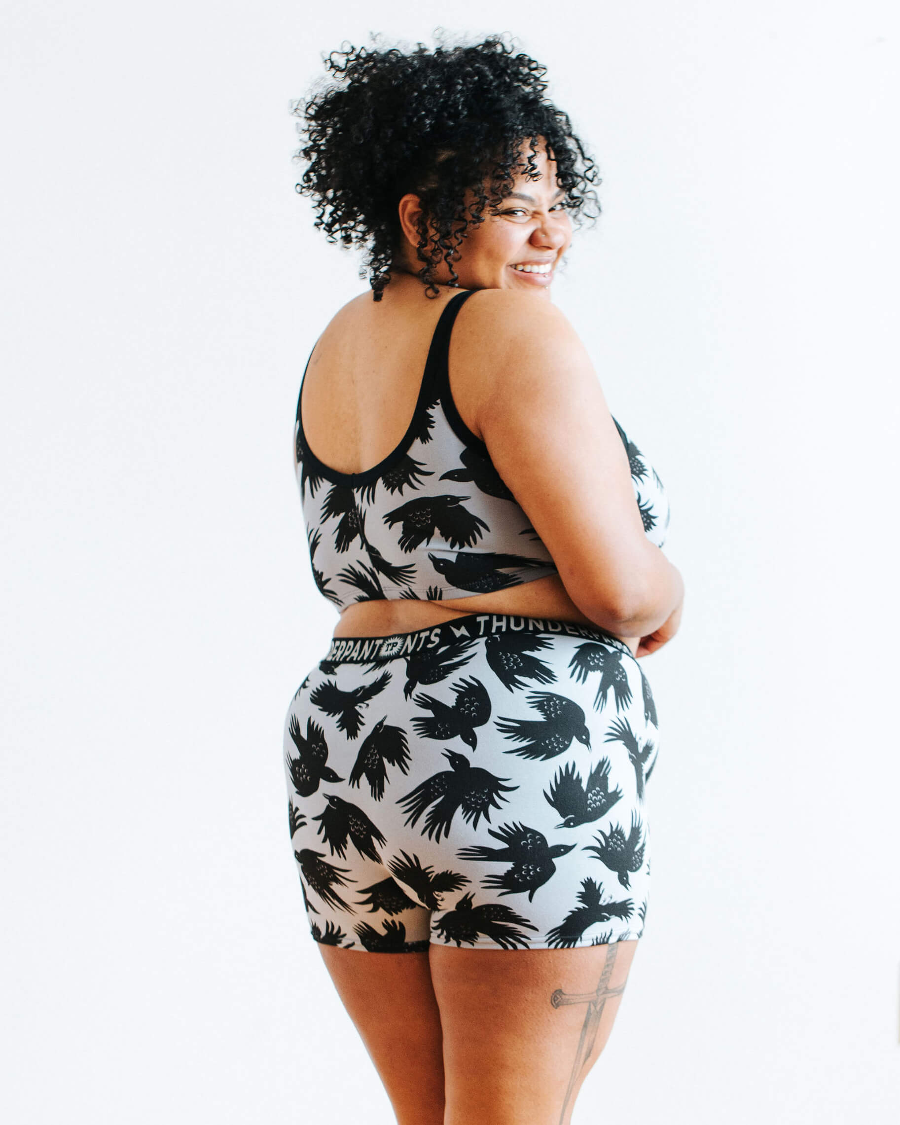 Model wearing Thunderpants Boxer Brief style underwear and Longline Bra in So it Crows print - black crows on grey.