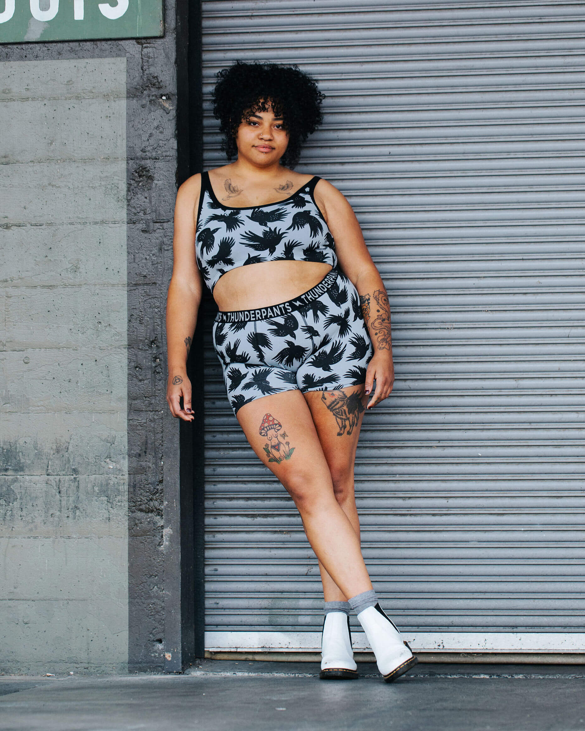 Model wearing Thunderpants Boxer Brief style underwear and Longline Bra in So it Crows print - black crows on grey.