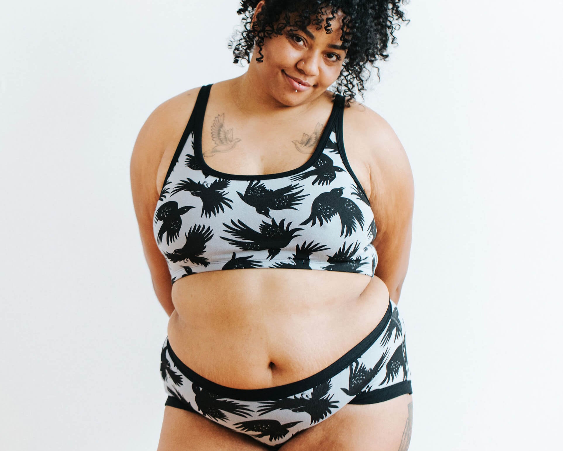Model wearing Thunderpants Hipster style underwear and Longline Bra in So it Crows - black crows on grey.