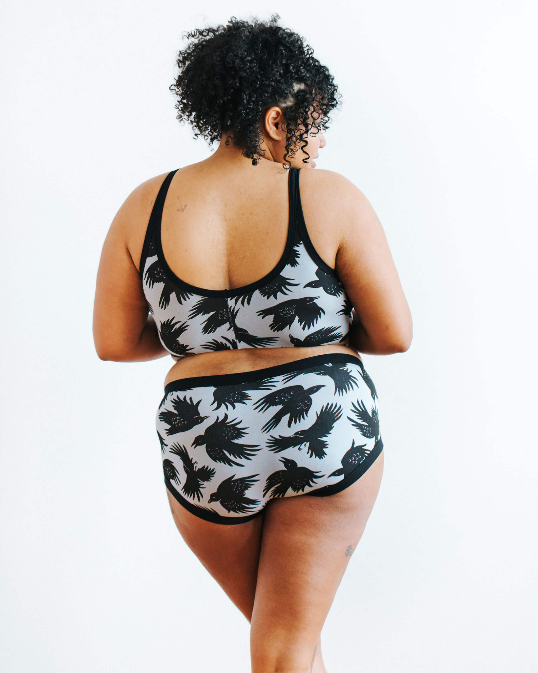 Model wearing Thunderpants Hipster style underwear and Longline Bra in So it Crows - black crows on grey.