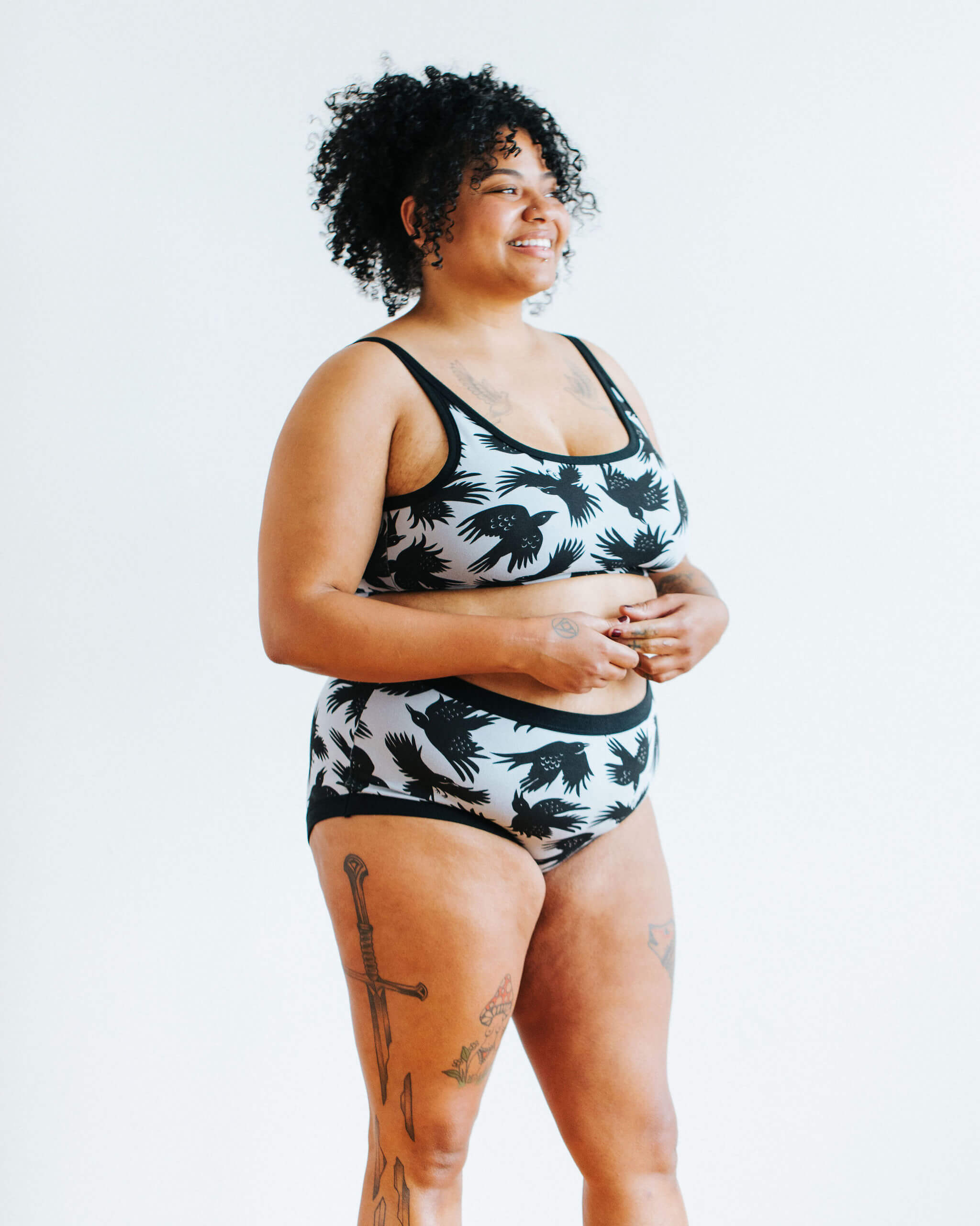 Model wearing Thunderpants Original style underwear and Longline Bra in So it Crows - black crows on grey.