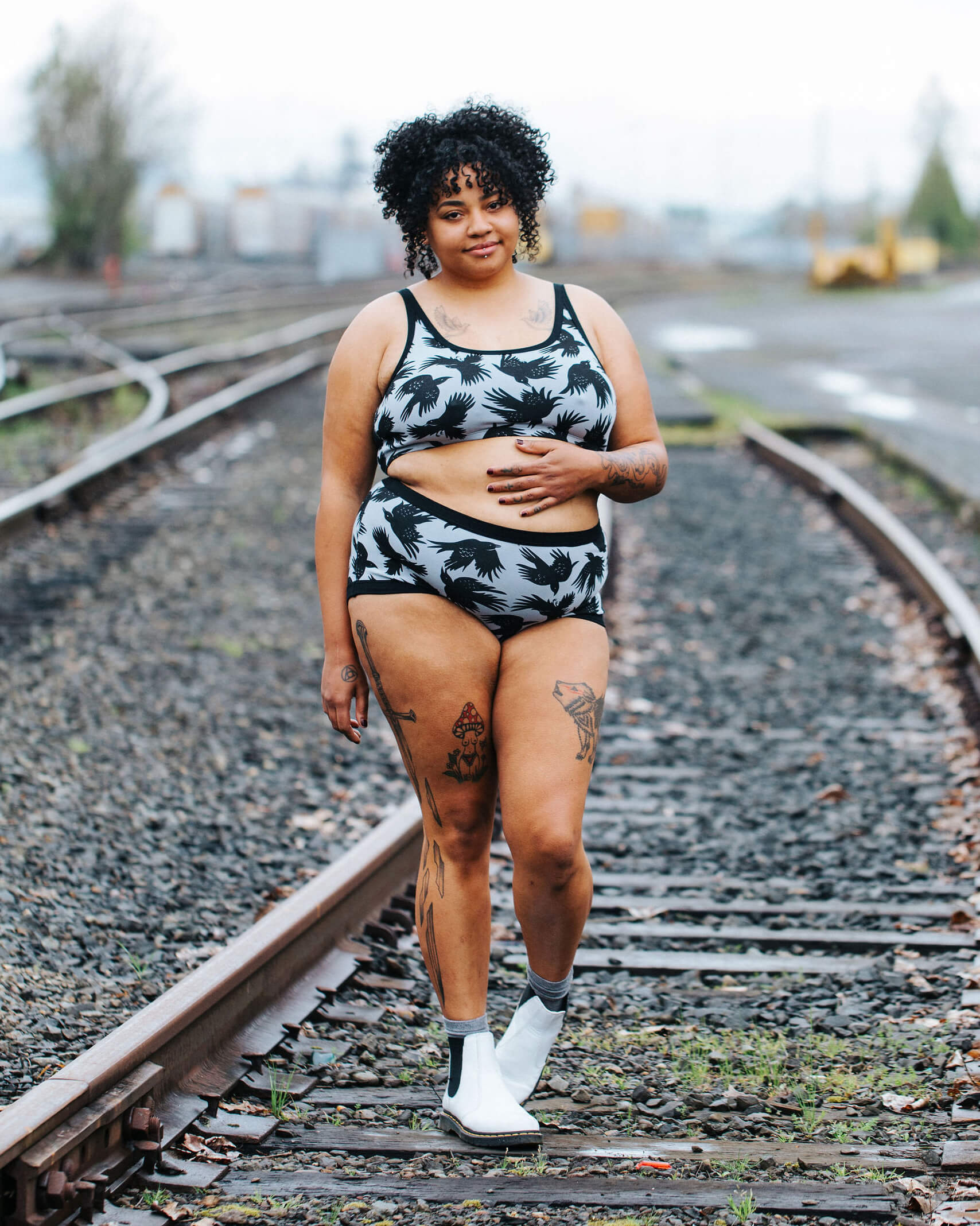 Model wearing Thunderpants Original style underwear and Longline Bra in So it Crows - black crows on grey.
