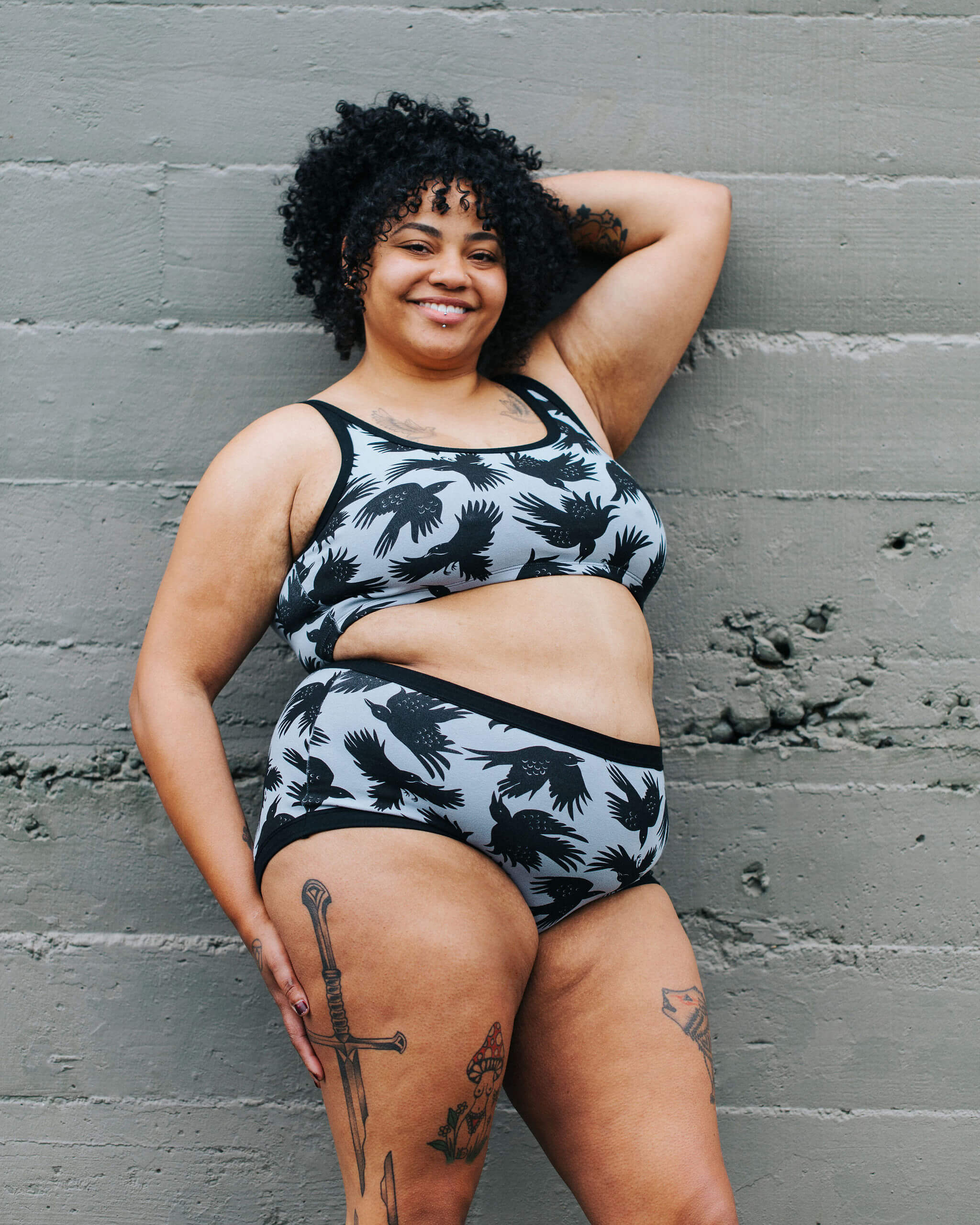 Model wearing Thunderpants Original style underwear and Longline Bra in So it Crows - black crows on grey.