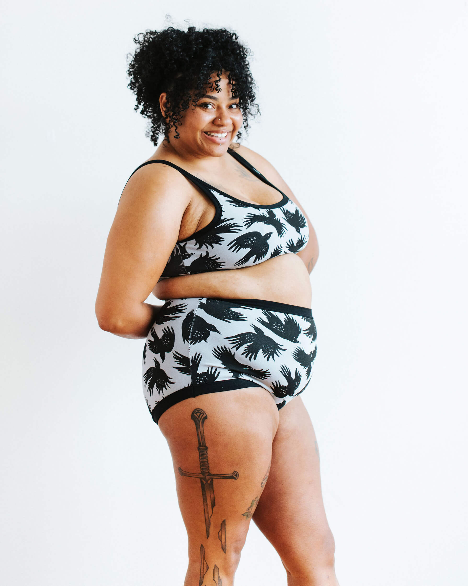 Model wearing Thunderpants Sky Rise style underwear and Longline Bra in So it Crows - black crows in grey.