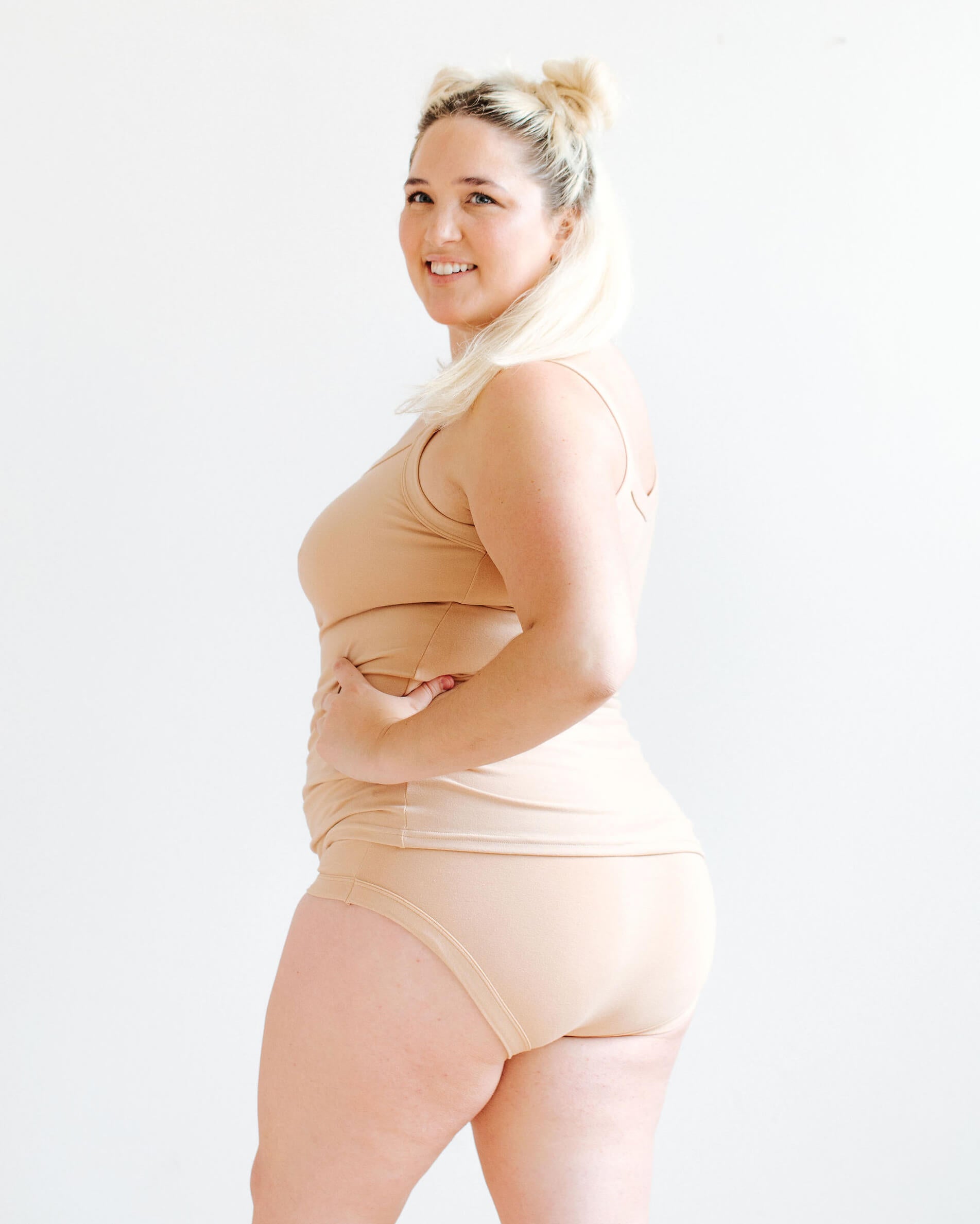 Model wearing Thunderpants Hipster style underwear and Camisole in Pine Nut - lighter tan color.