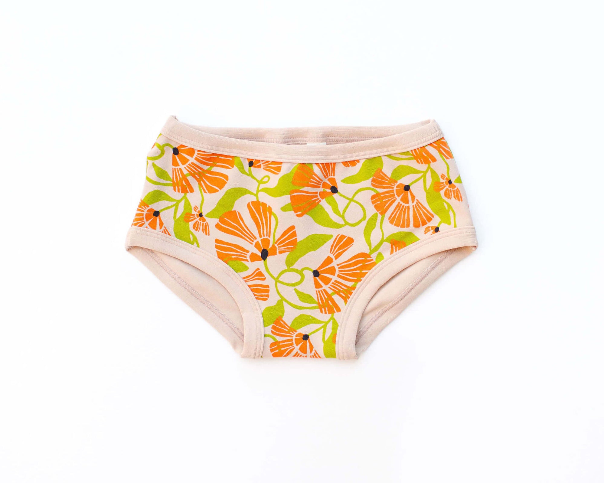 Flat lay of Thunderpants Kid's style underwear in Secret Garden - orange and green flowers.