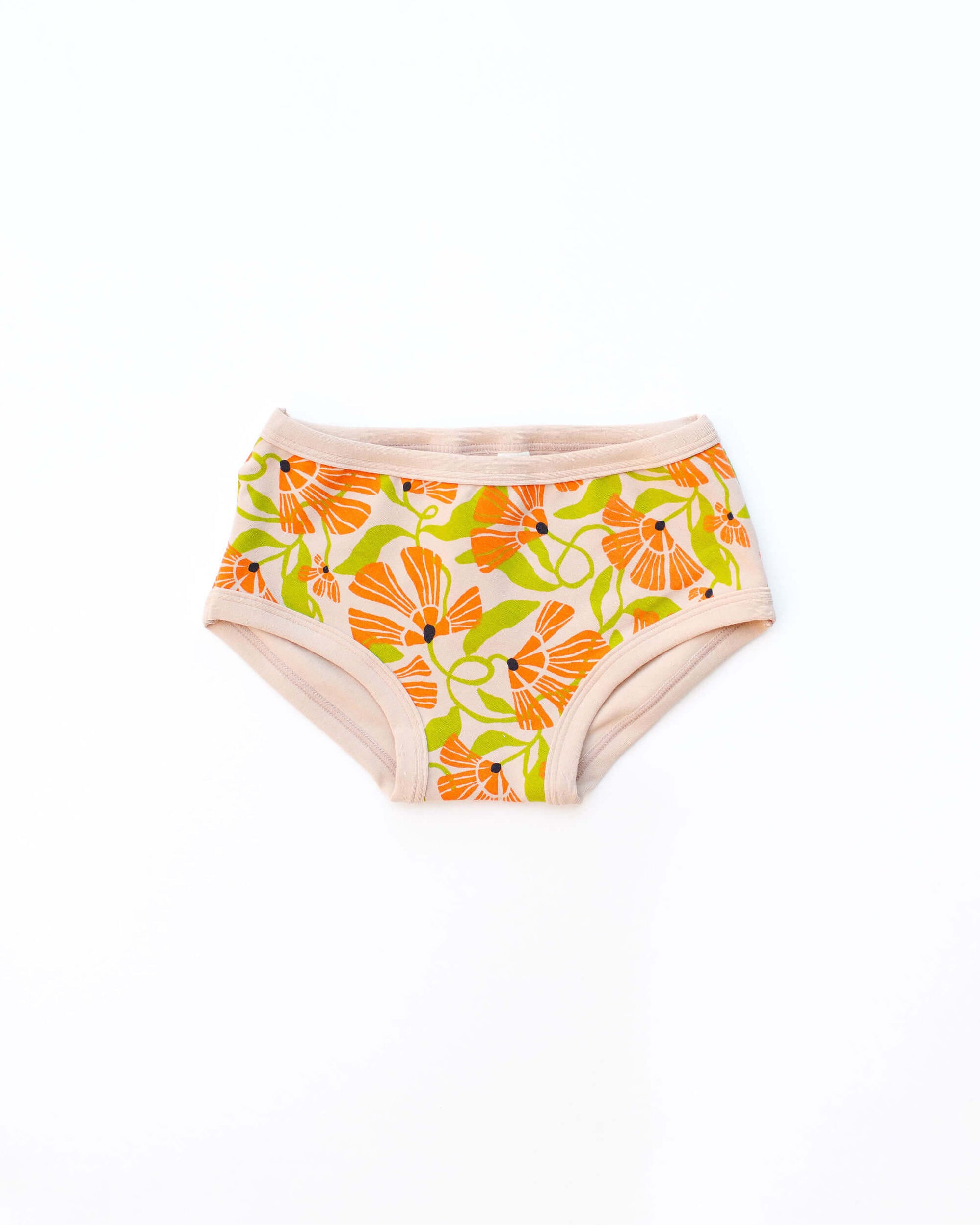 Flat lay of Thunderpants Kid's style underwear in Secret Garden - orange and green flowers.