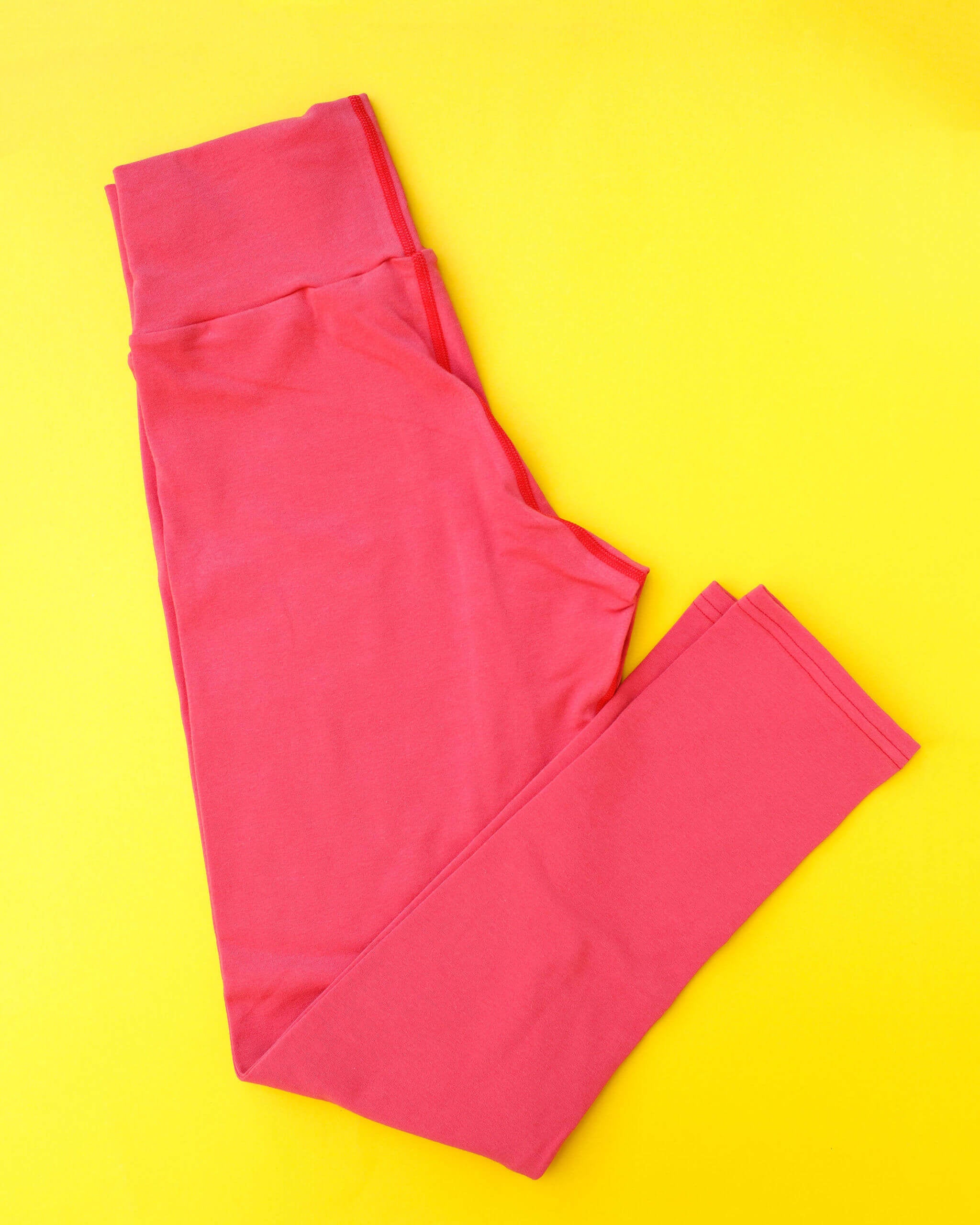 Flat lay of Thunderpants Ankle Length Leggings in Pomegranate Punch.