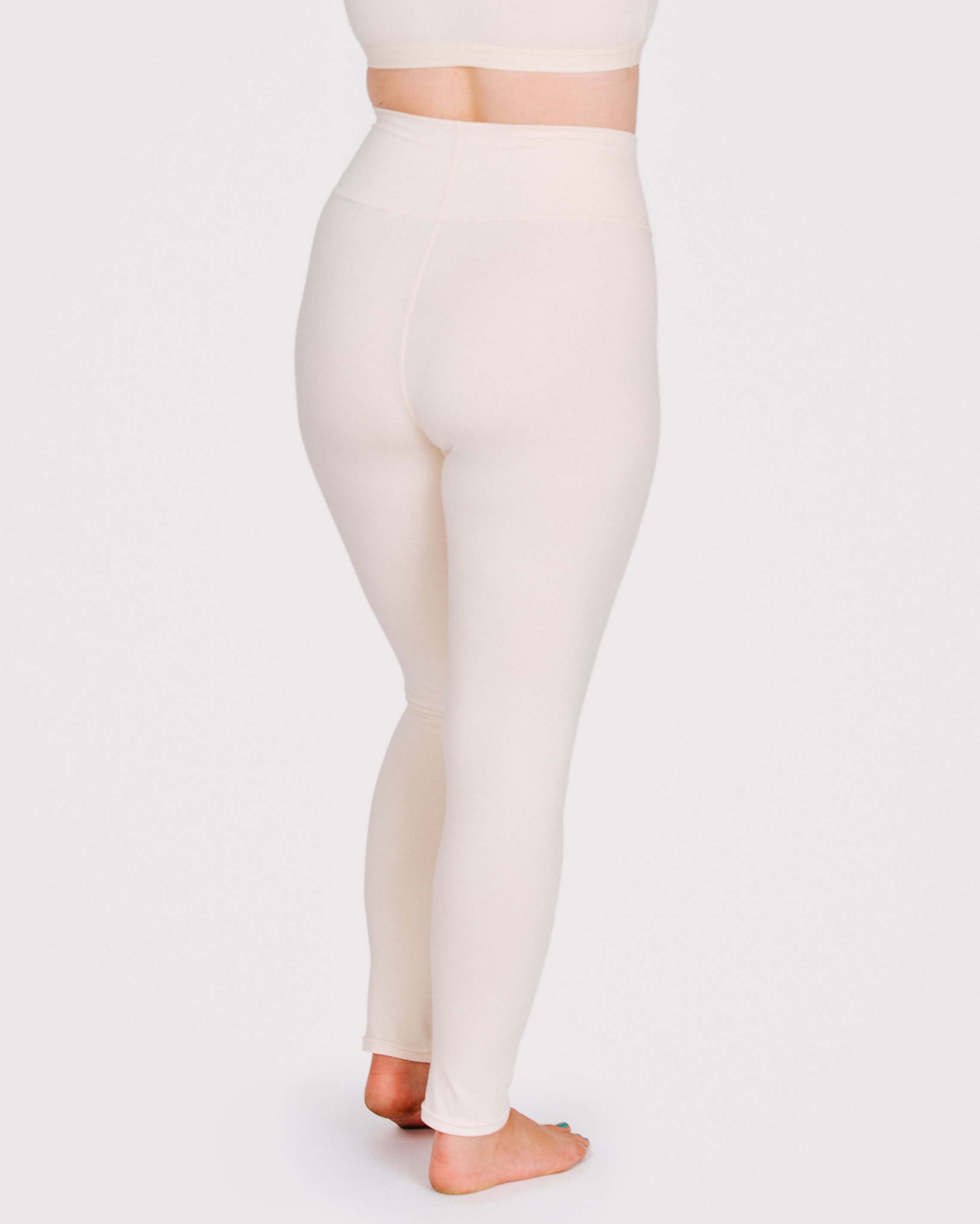 Fit photo from the back of Thunderpants organic cotton Leggings in off-white on a model.