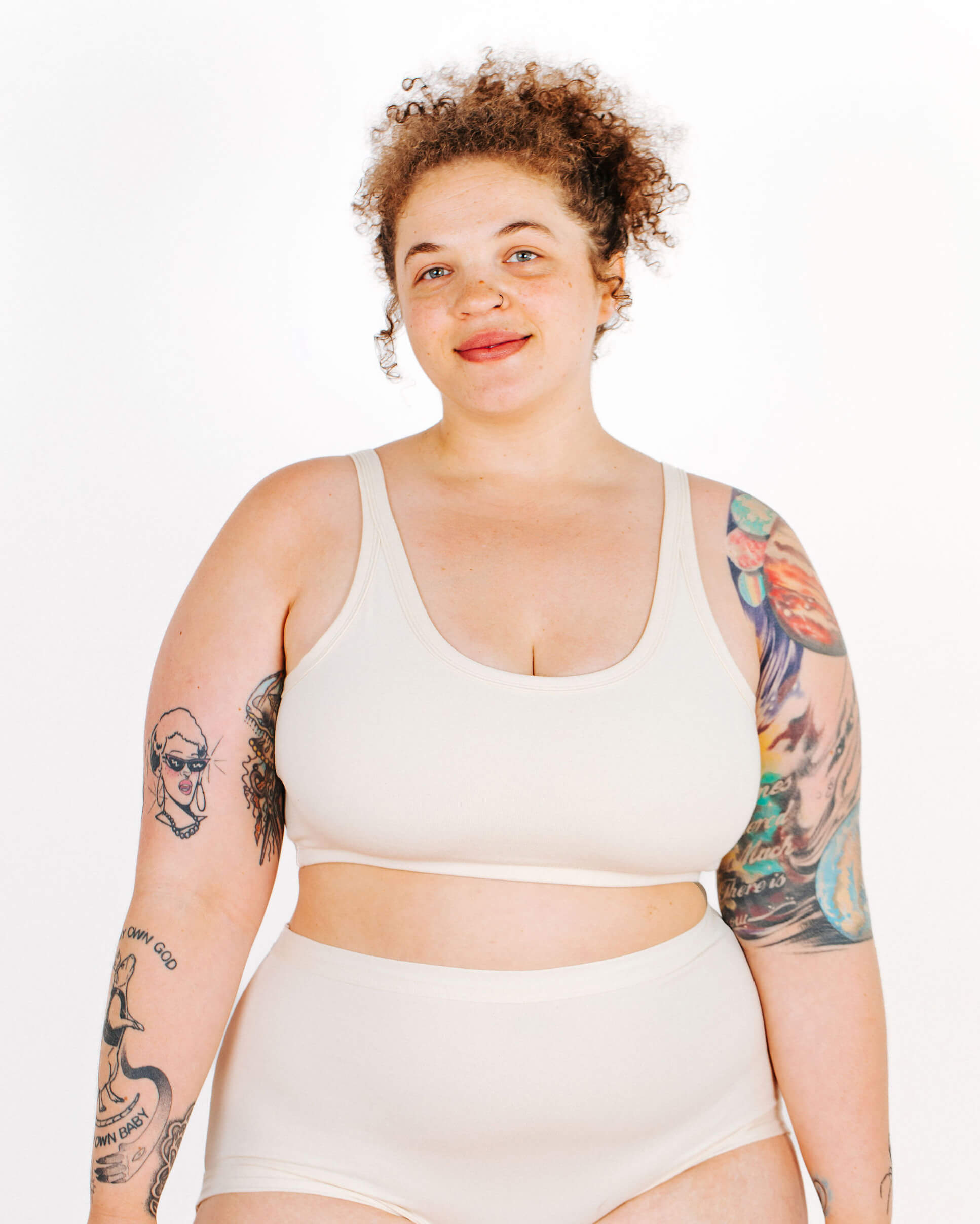 Fit photo from the front of Thunderpants organic cotton Longline Bra in off-white on a model.