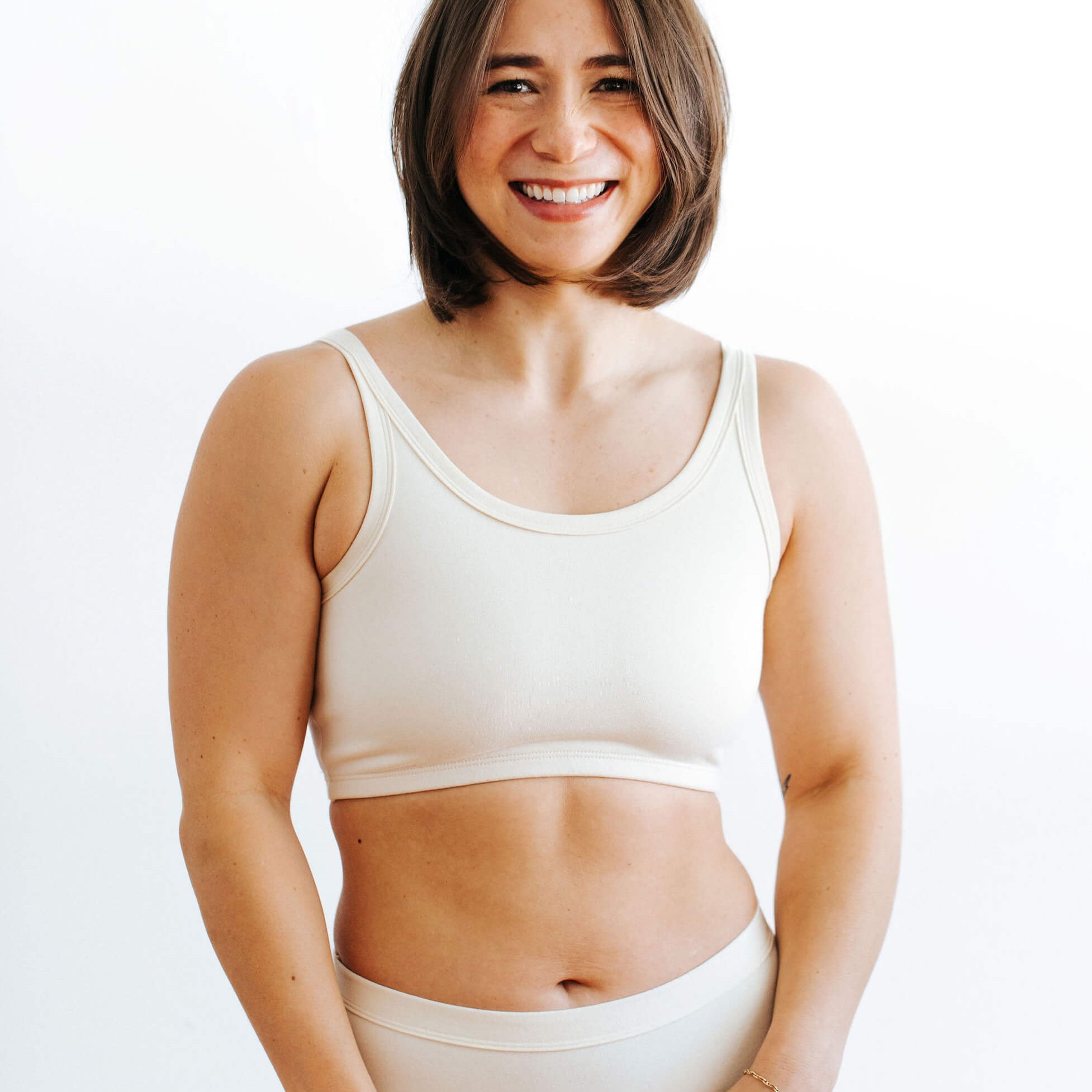 Fit photo from the front of Thunderpants organic cotton Longline Bra in off-white on a model.