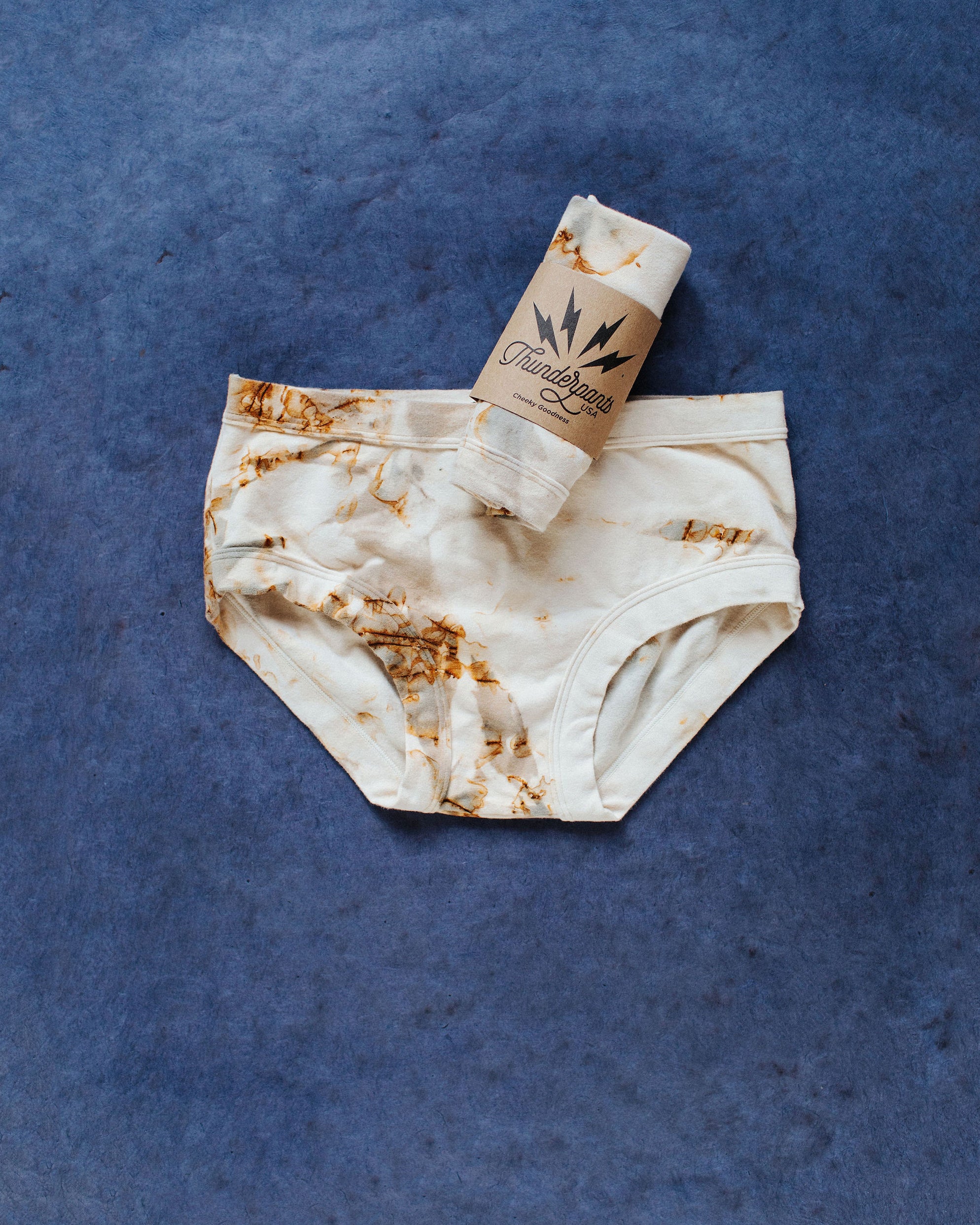 Flat lay of Thunderpants Hipster style underwear in Mineral Rust Dye.