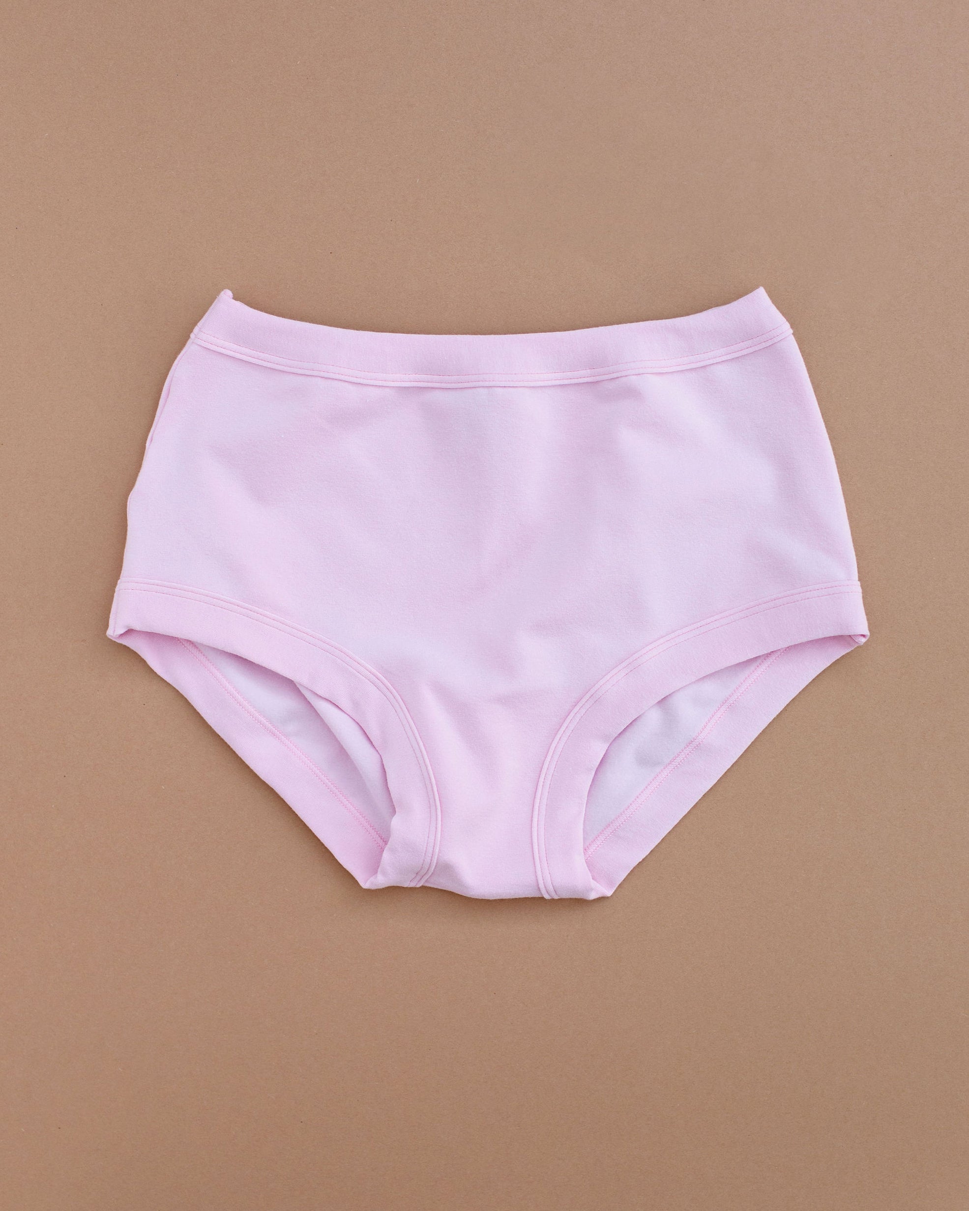 Flat lay of Thunderpants Original style underwear in Plié Pink - light pink color.