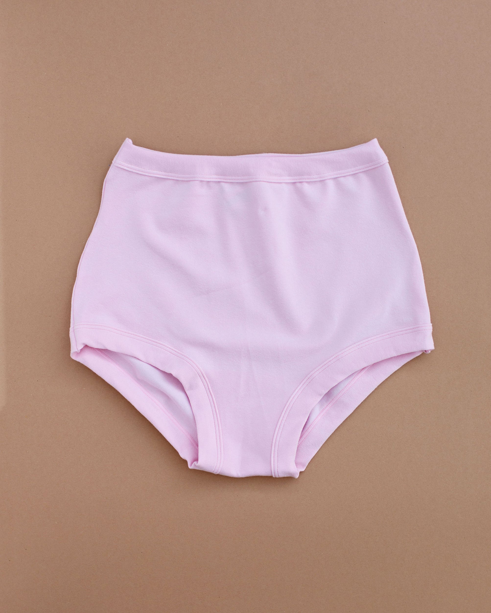 Flat lay of Thunderpants Sky Rise style underwear in Plié Pink - light pink color.