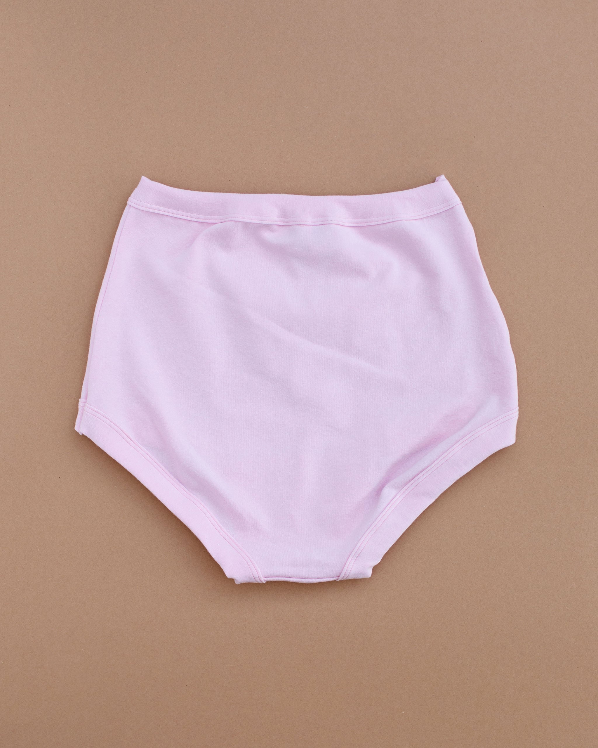 Flat lay of Thunderpants Sky Rise style underwear in Plié Pink - light pink color.