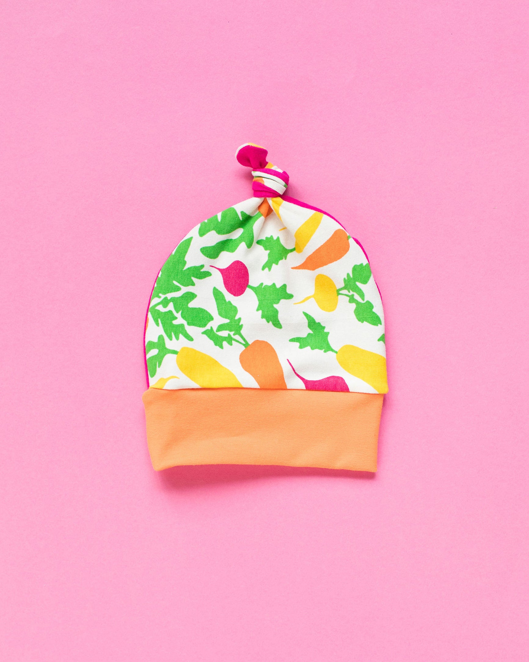 Flat lay of one Thunderpants Scrap Baby Hat - multiple colors and prints.
