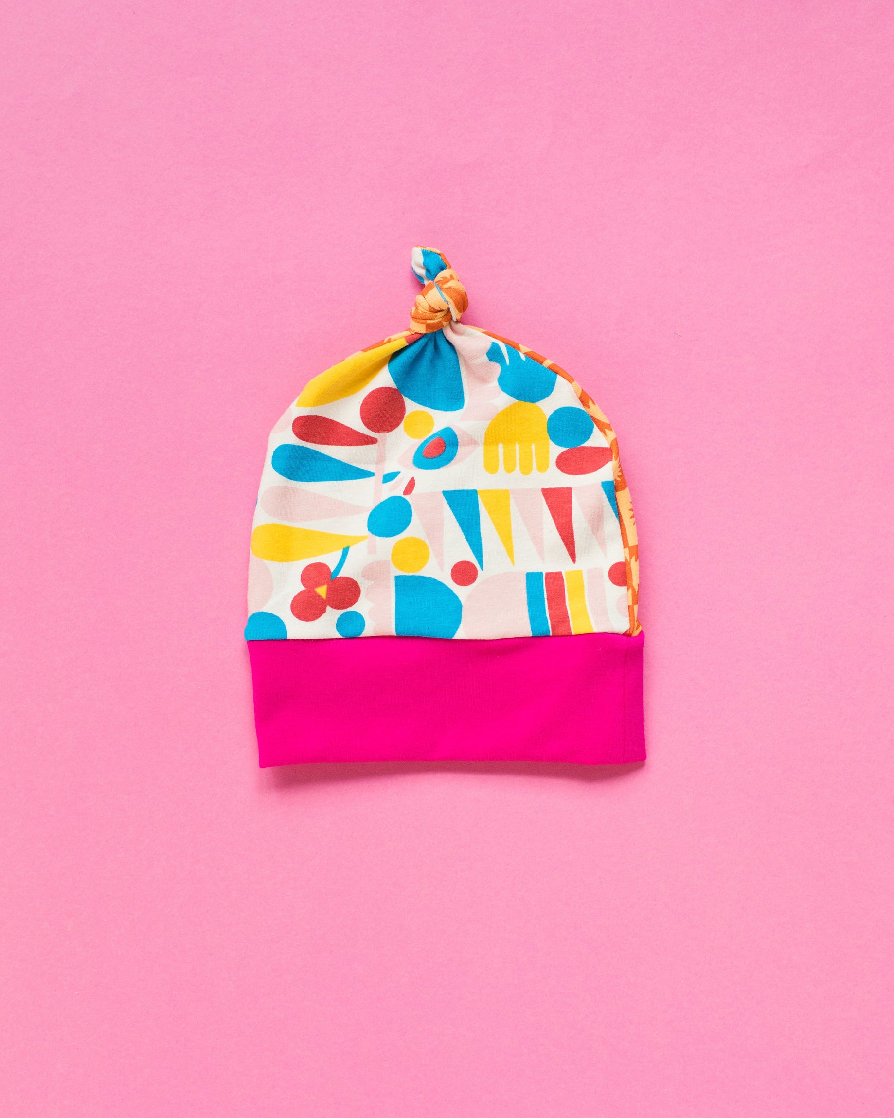 Flat lay of one Thunderpants Scrap Baby Hat - multiple colors and prints.