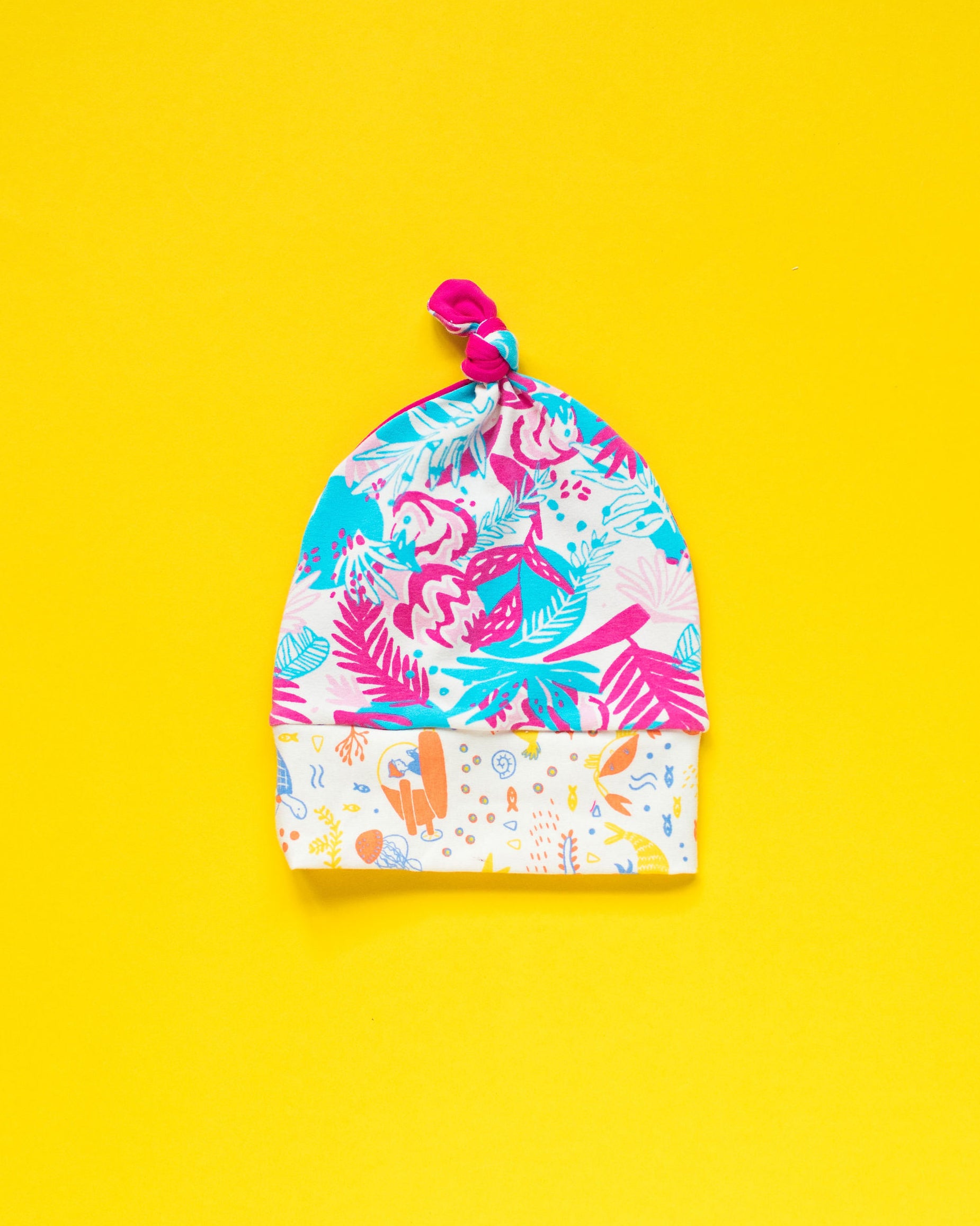 Flat lay of one Thunderpants Scrap Baby Hat - multiple colors and prints.