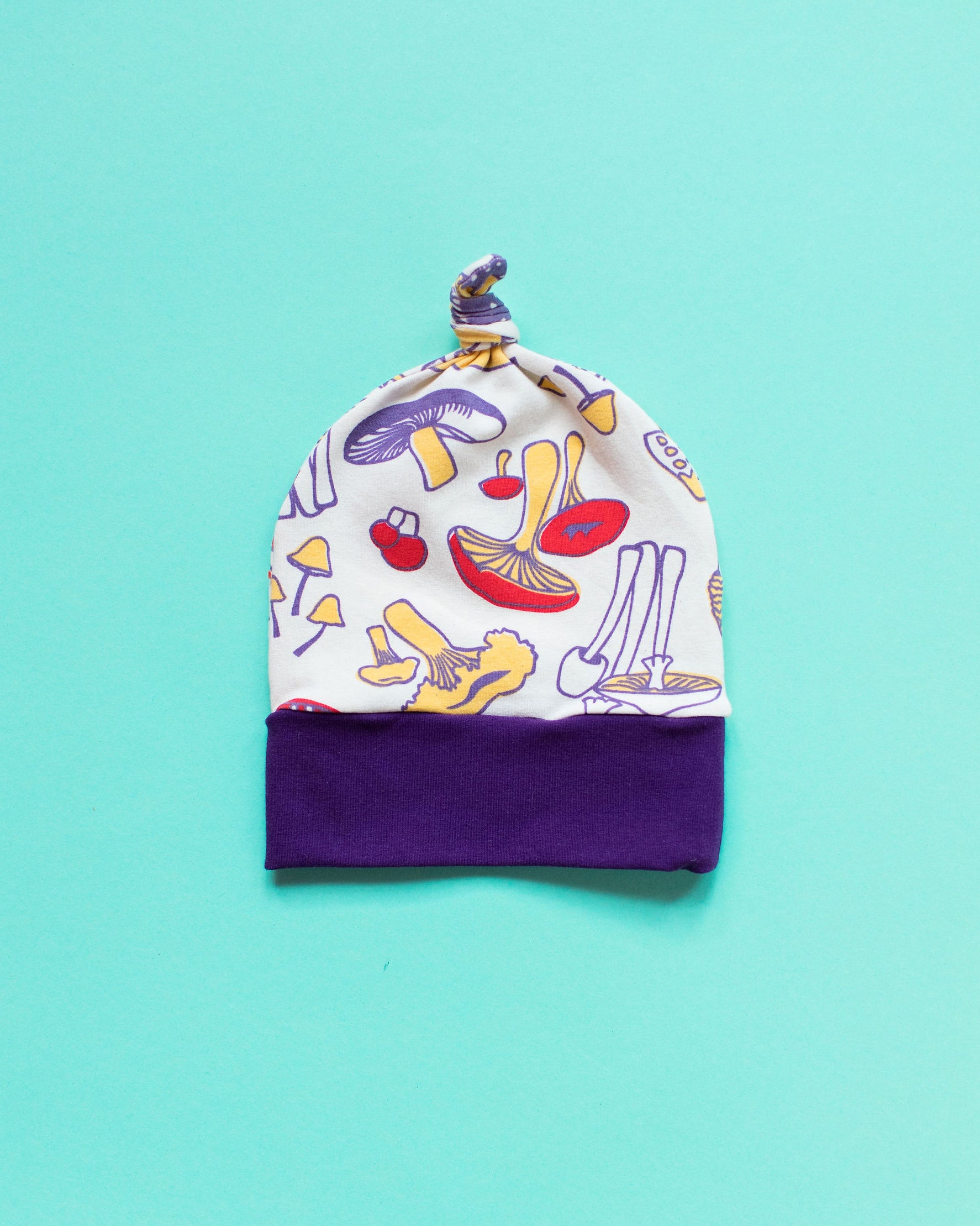 Flat lay of one Thunderpants Scrap Baby Hat - multiple colors and prints.