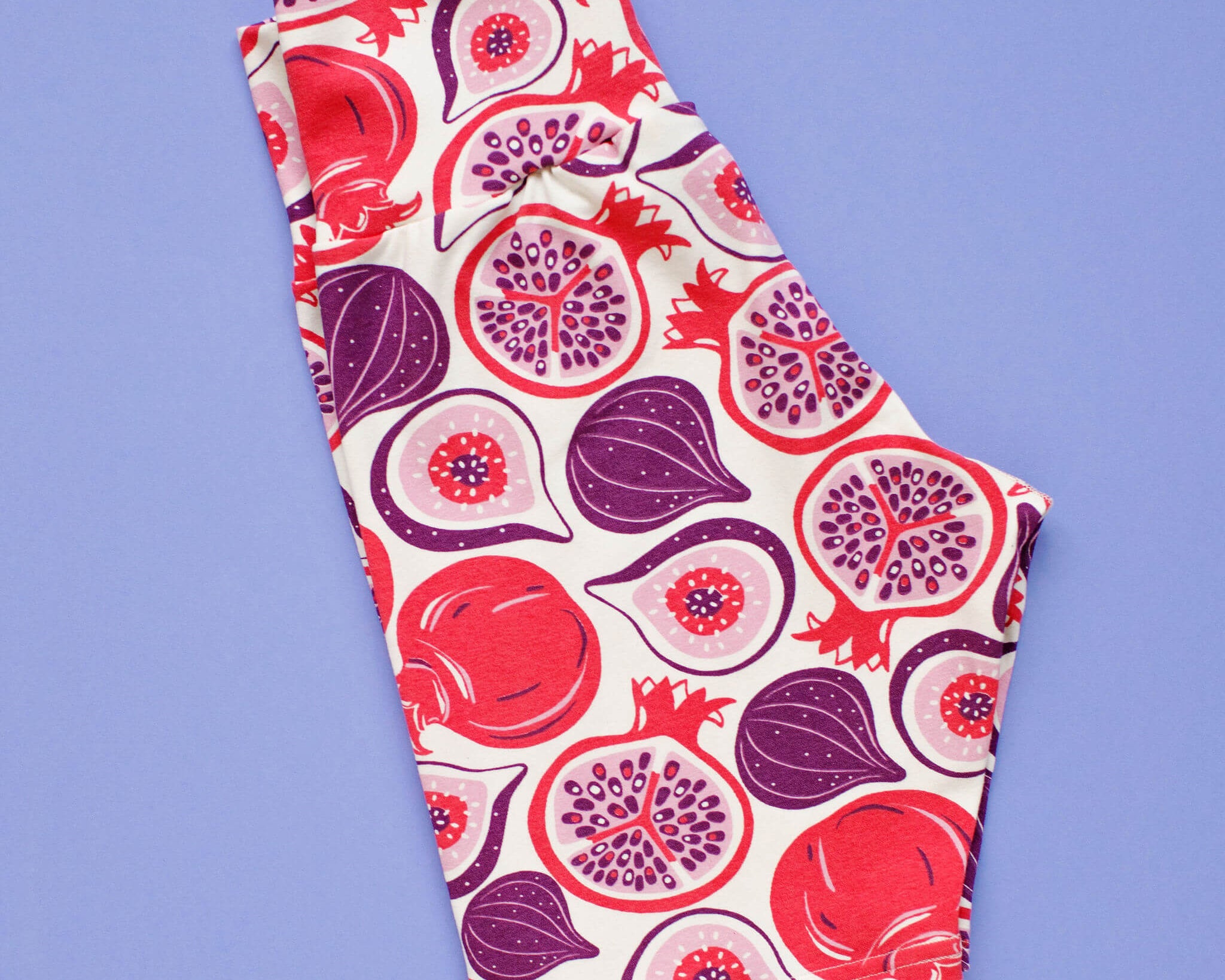 Flat lay of Thunderpants Bike Shorts in Two Fruits print - figs and pomegranates.