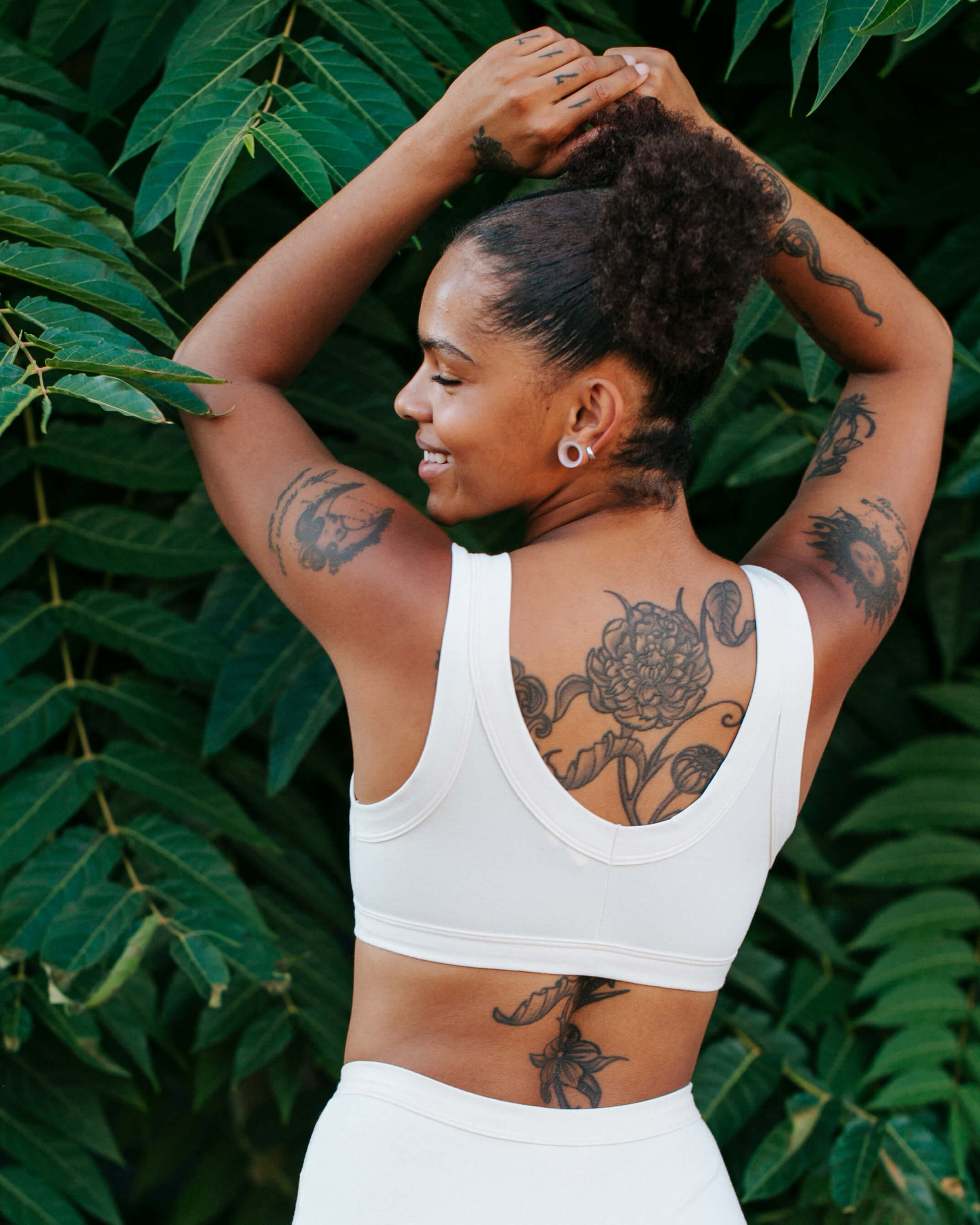 Back of model wearing Thunderpants Bralette in Plain Vanilla.
