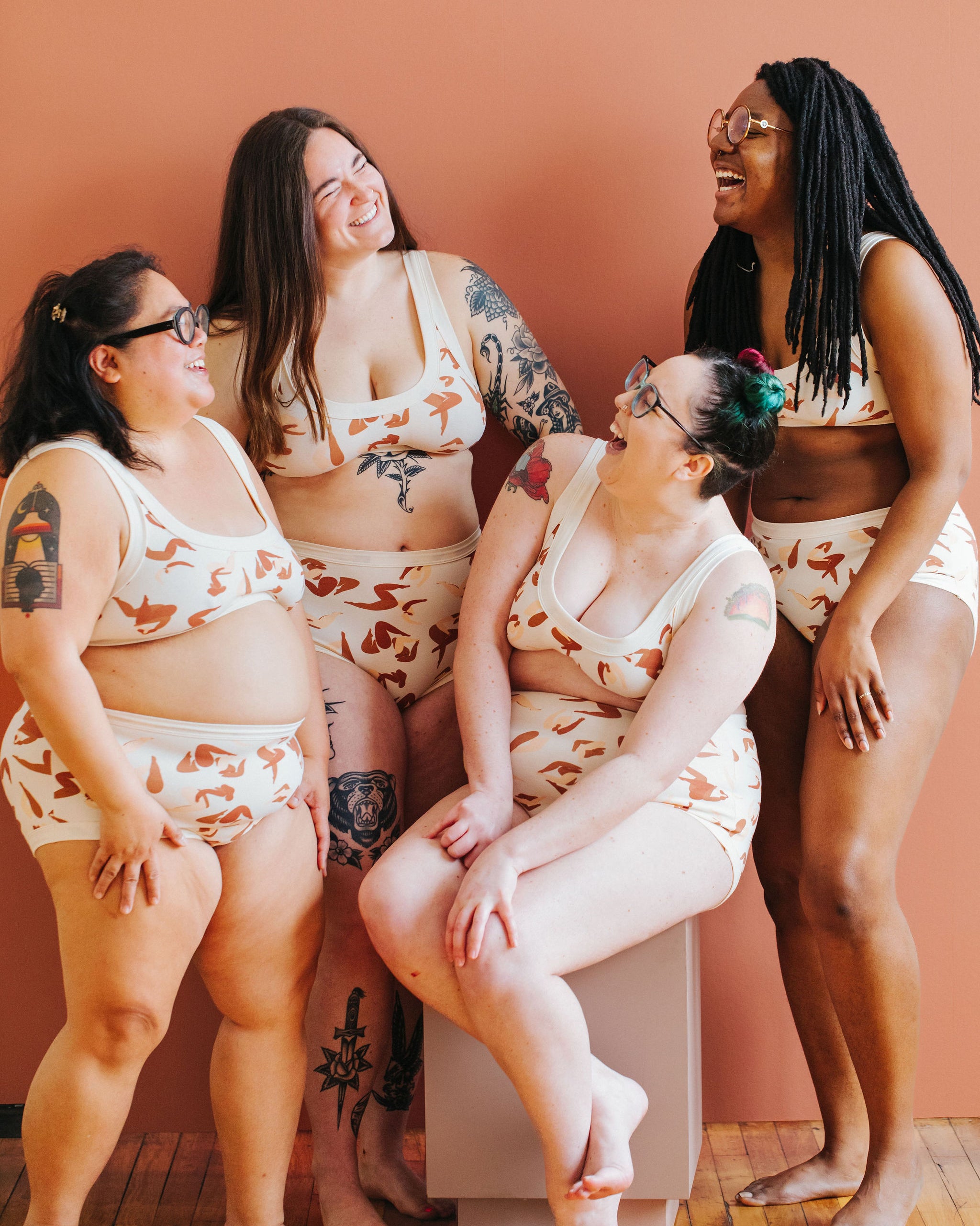 Four models wearing various styles of Thunderpants in Bodies in Motion: women in different shades of browns and tans.