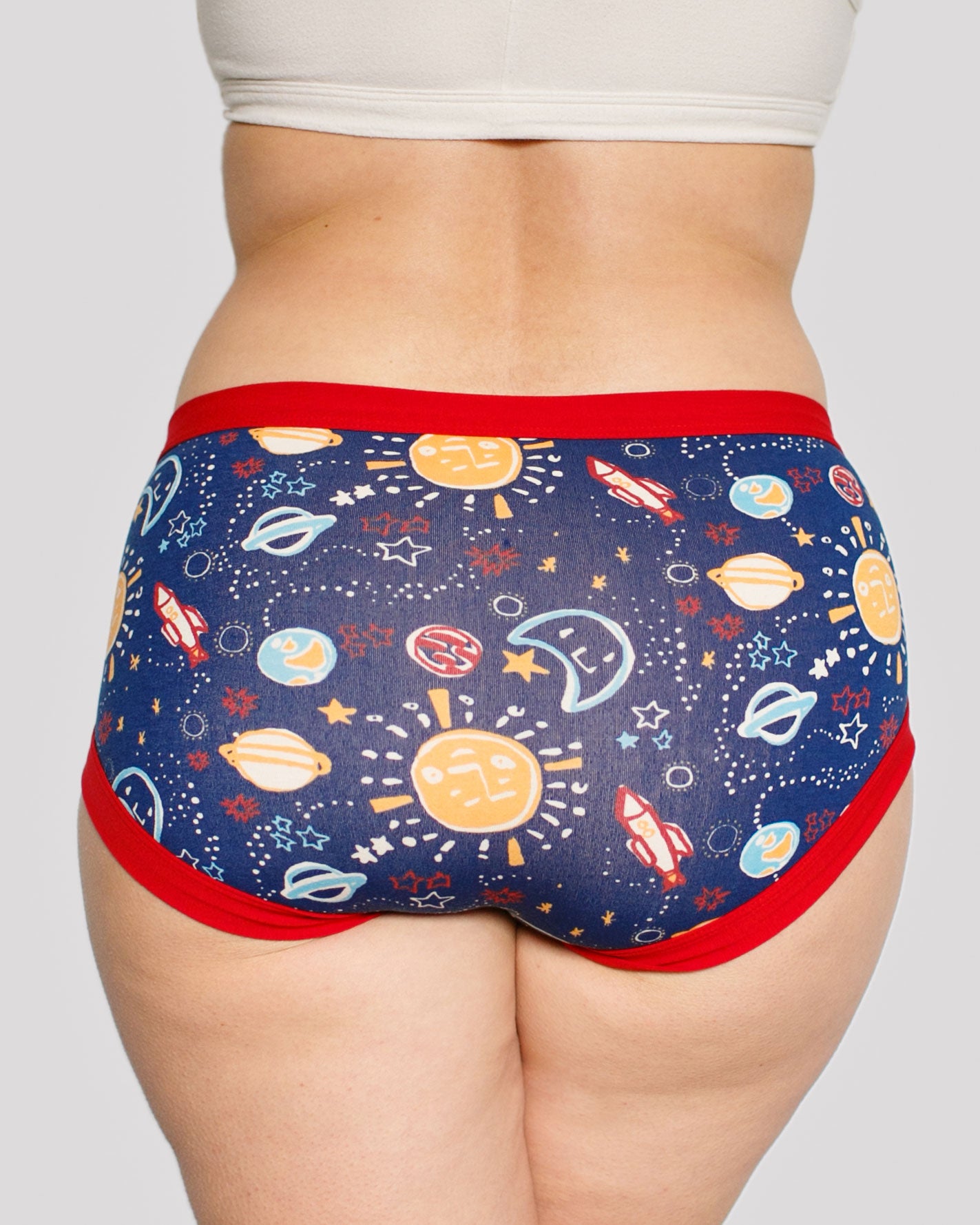 Model's bum wearing Thunderpants organic cotton Hipster style underwear in a sun, planets, stars, and universe print.