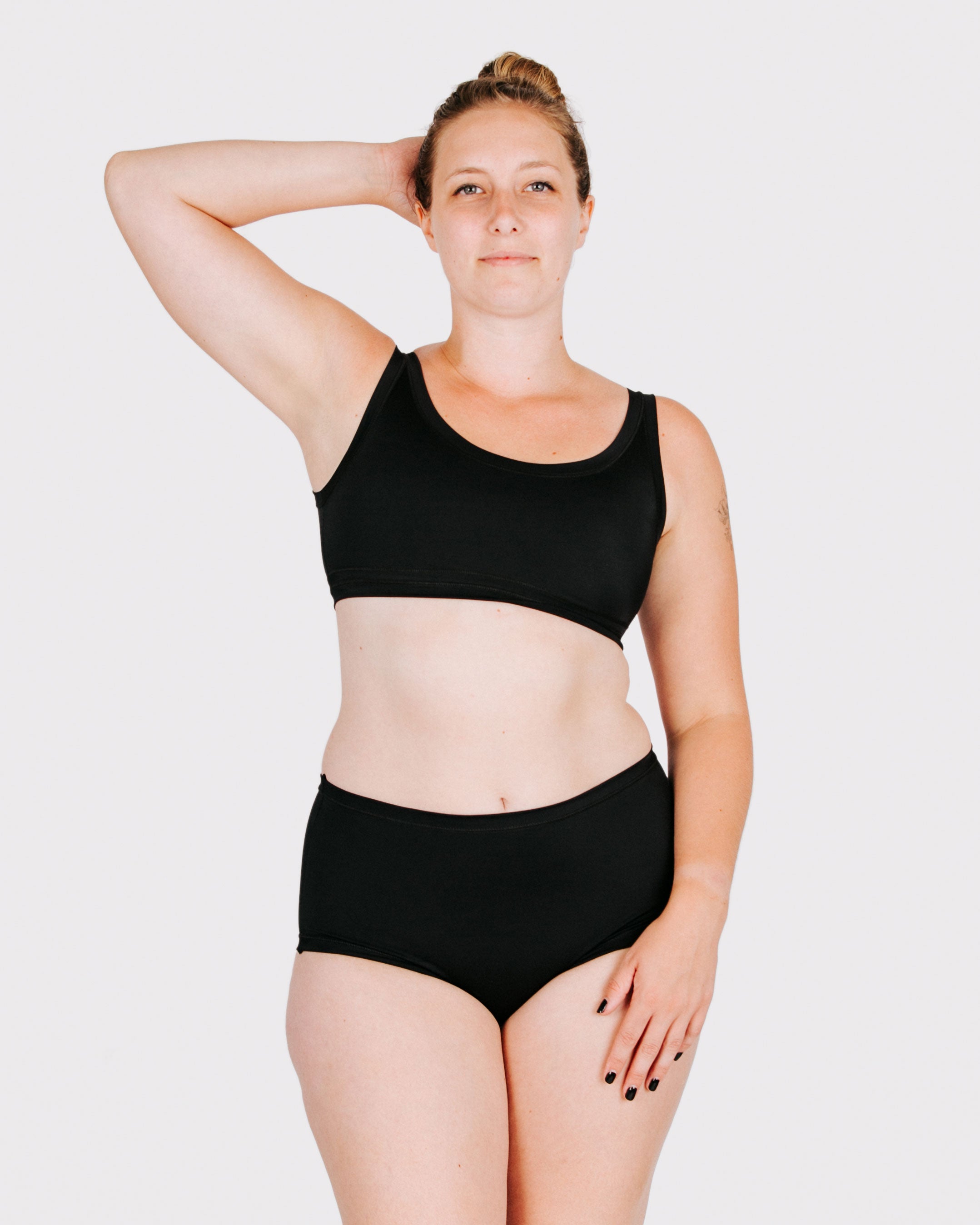 Fit photo from the front of Thunderpants recycled nylon Swimwear Original style bottoms in Plain Black on a model.