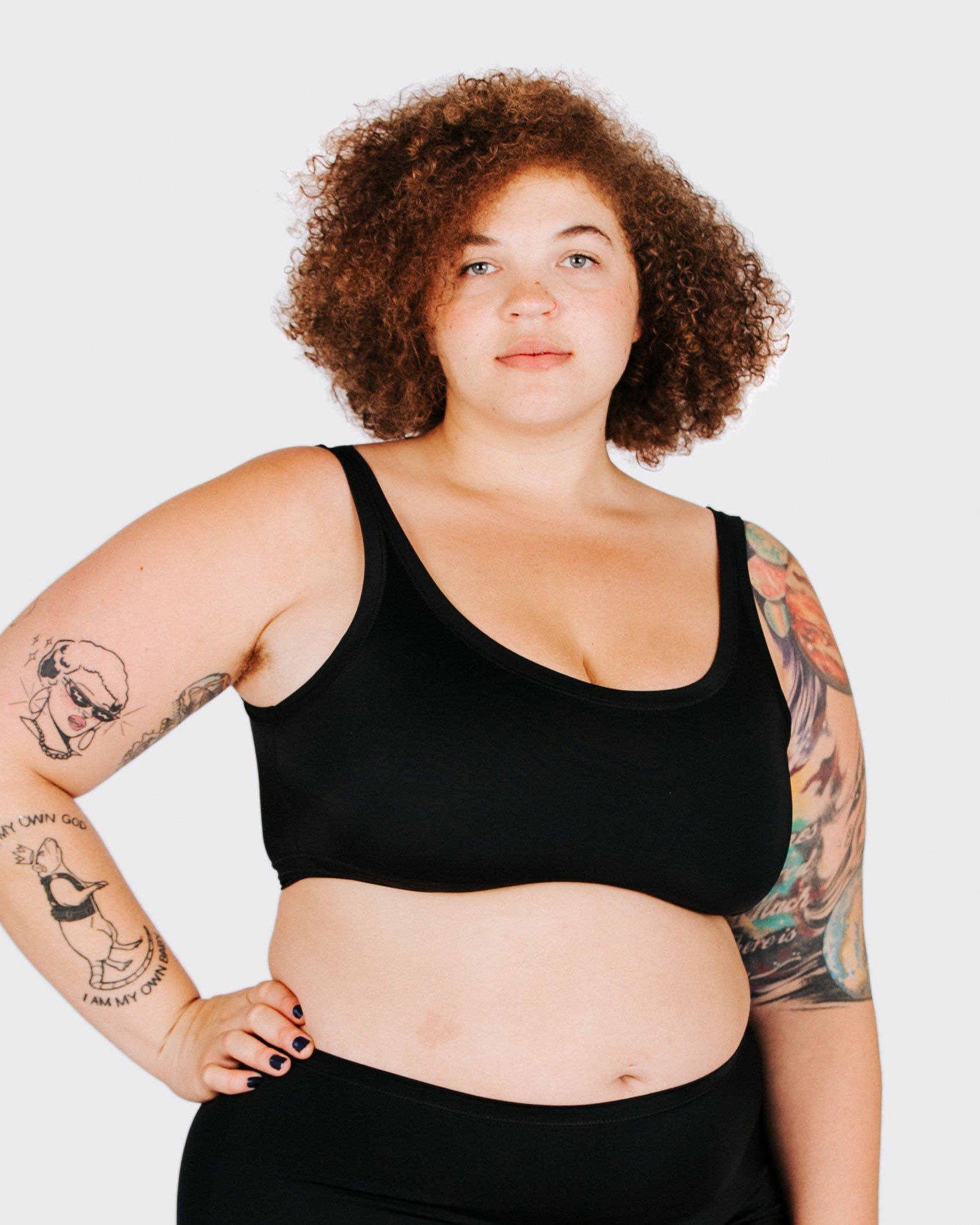 Fit photo from the front of Thunderpants recycled nylon Swimwear Top in Plain Black on a model.