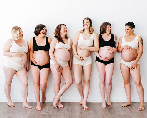 Group of six pregnant Women wearing Thunderpants Organic Cotton Original and Hipster underwear and Bralettes in both plain Vanilla and plain Black colors.