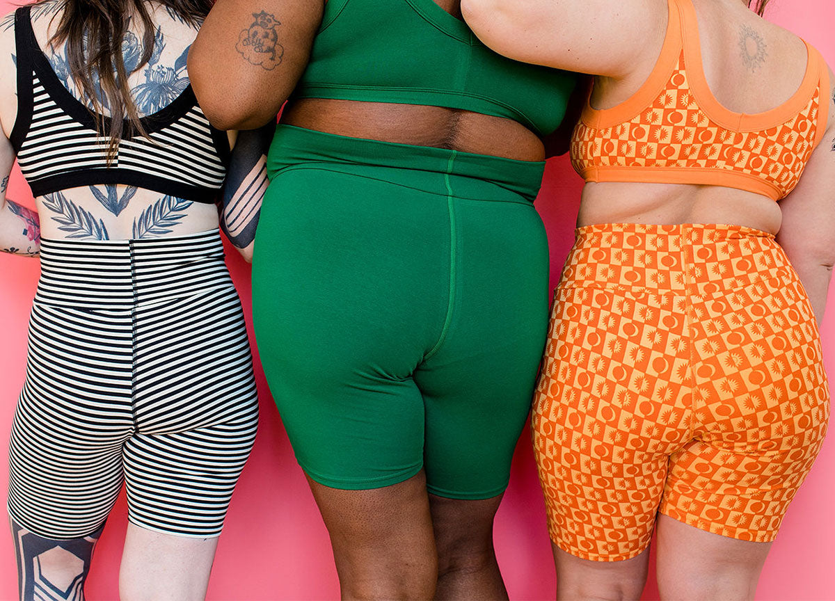 Three models wearing various prints of Thunderpants Bike Shorts.